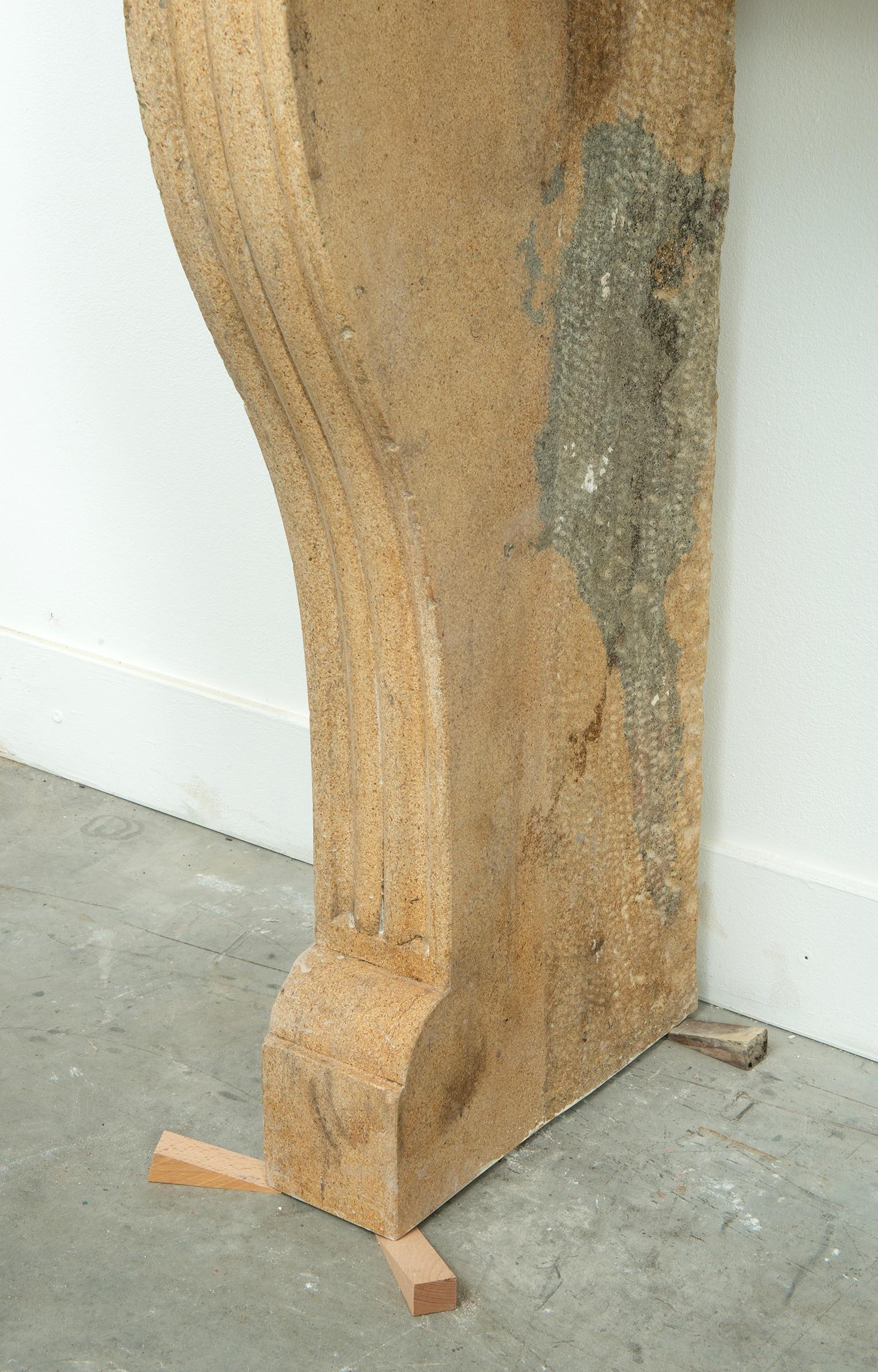 19th Century French Campagnard Limestone Fireplace with Sculpted Scroll Jambs For Sale 17