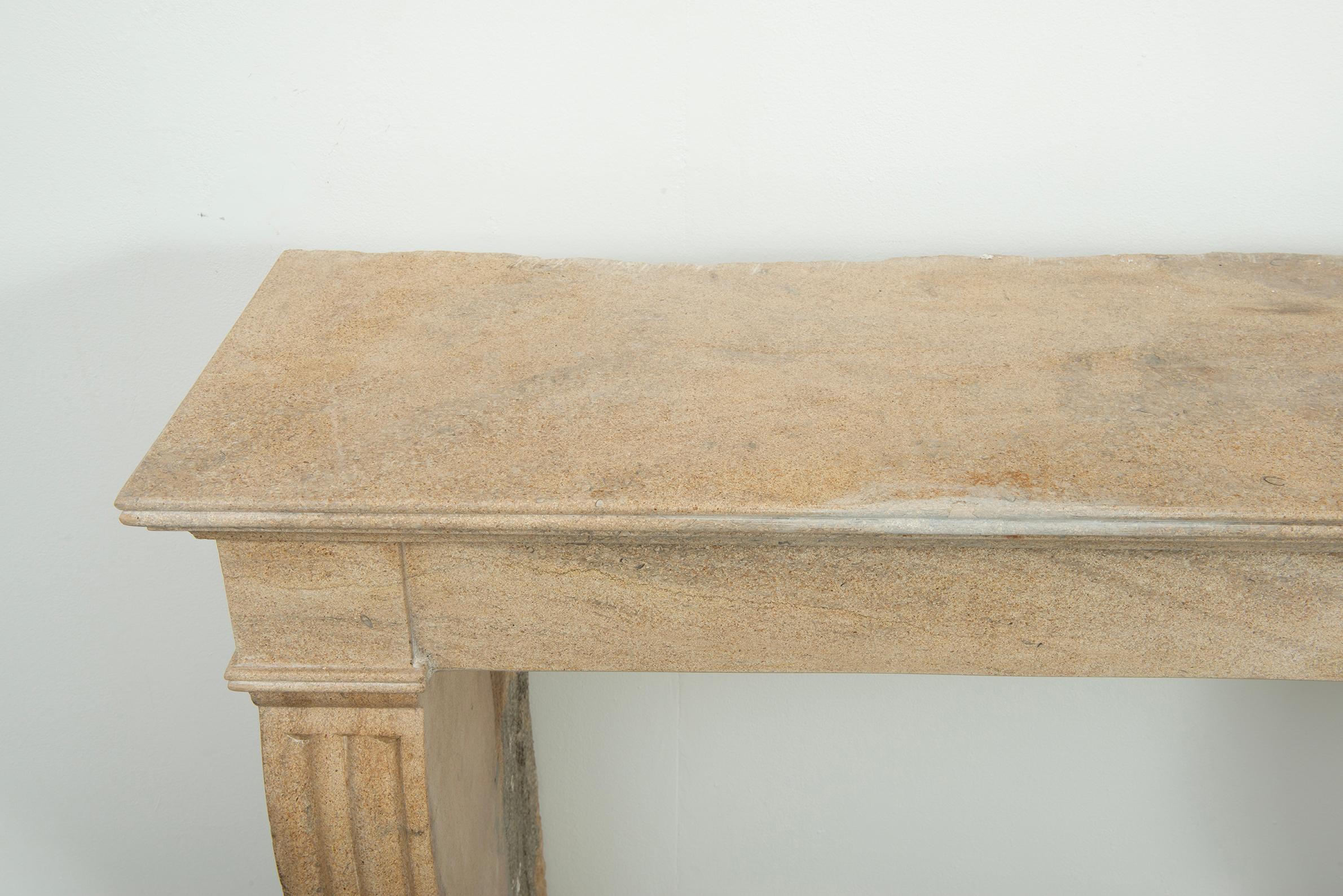 19th Century French Campagnard Limestone Fireplace with Sculpted Scroll Jambs For Sale 1