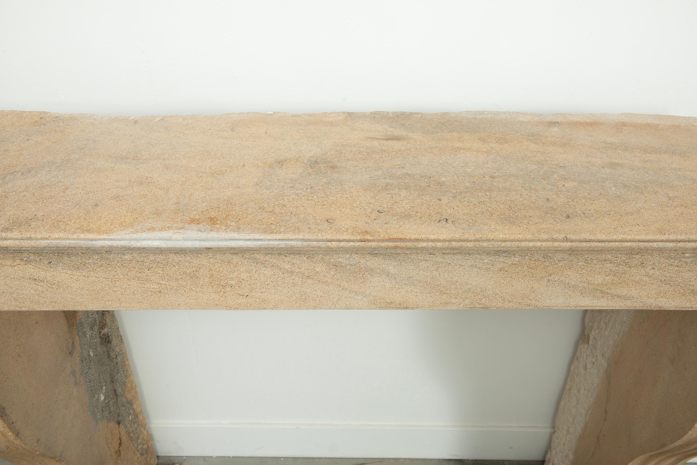 19th Century French Campagnard Limestone Fireplace with Sculpted Scroll Jambs For Sale 2