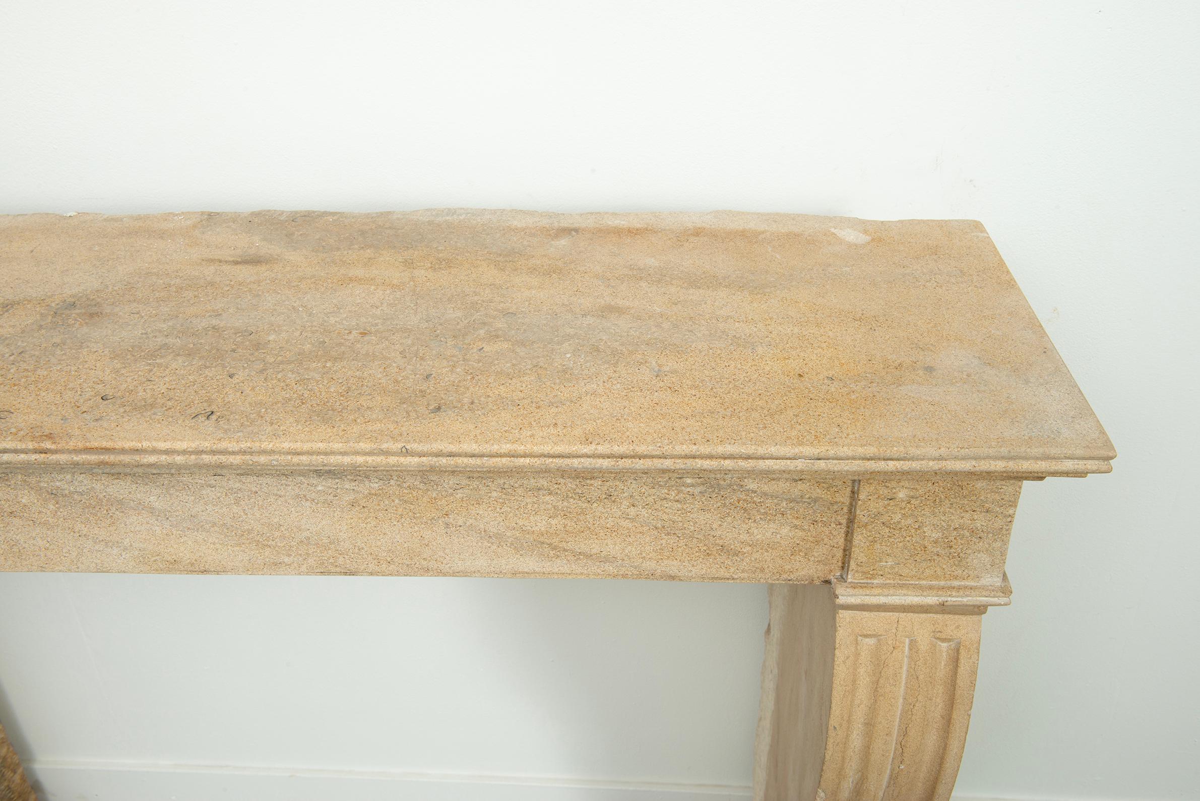 19th Century French Campagnard Limestone Fireplace with Sculpted Scroll Jambs For Sale 3