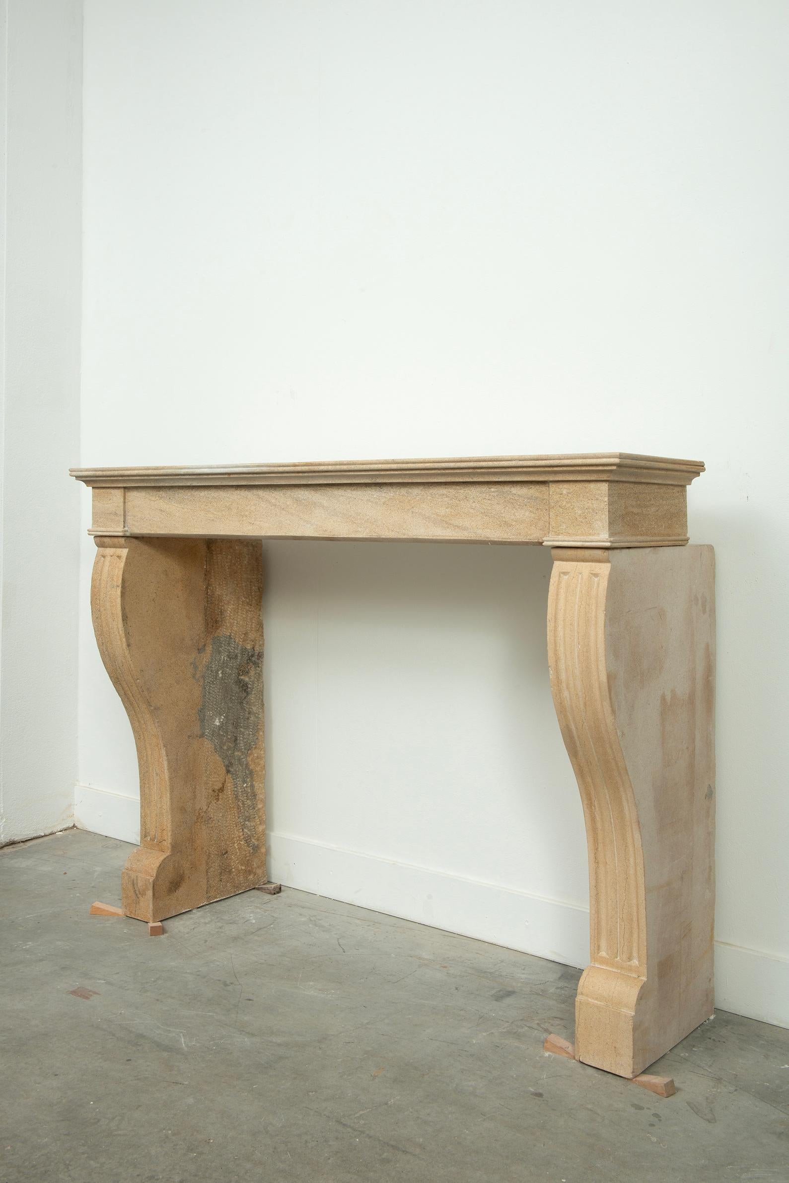 19th Century French Campagnard Limestone Fireplace with Sculpted Scroll Jambs For Sale 4
