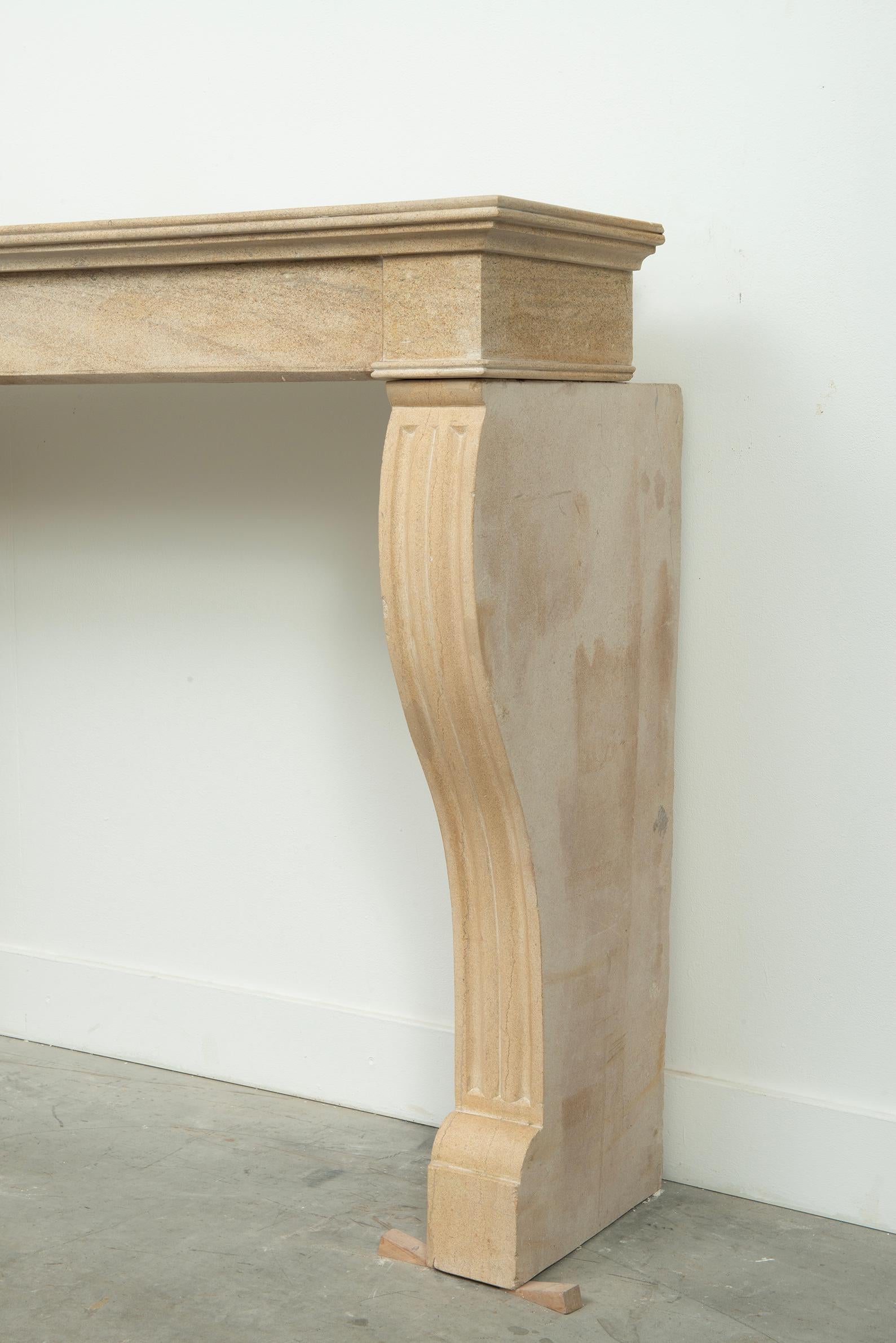 19th Century French Campagnard Limestone Fireplace with Sculpted Scroll Jambs For Sale 5