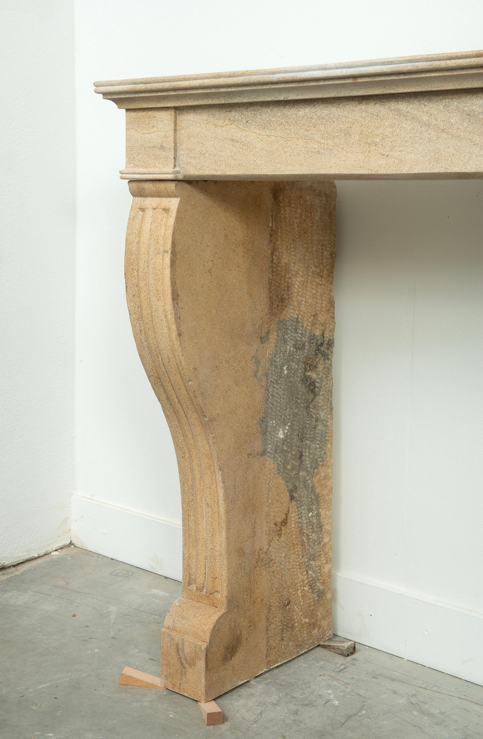 19th Century French Campagnard Limestone Fireplace with Sculpted Scroll Jambs For Sale 6