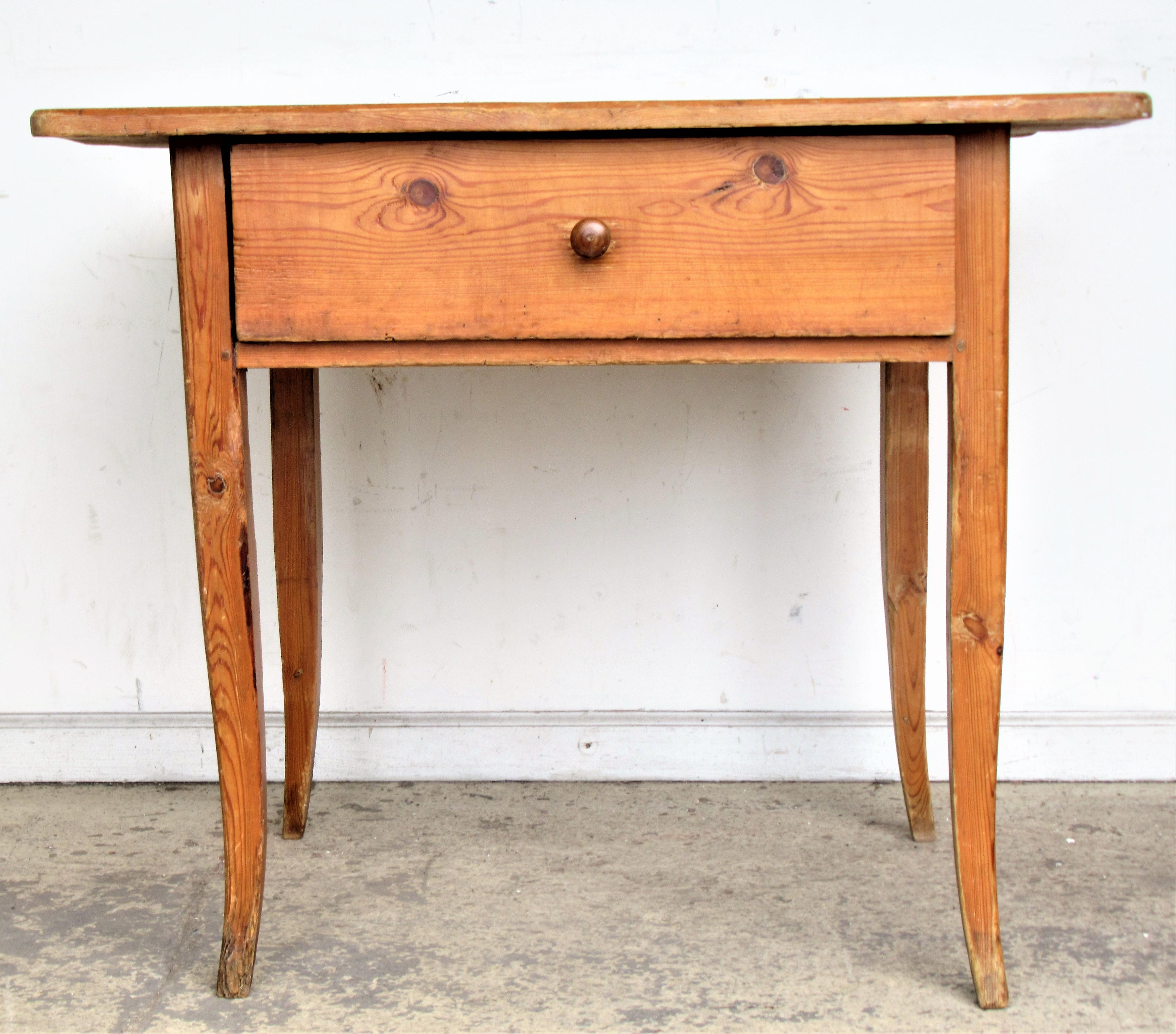 19th century French Canadian yellow pine country work table with one large deep dovetailed / chamfered central drawer, overhanging one board top / cabriole legs / early pegged construction - overall beautifully aged original warm honey colored