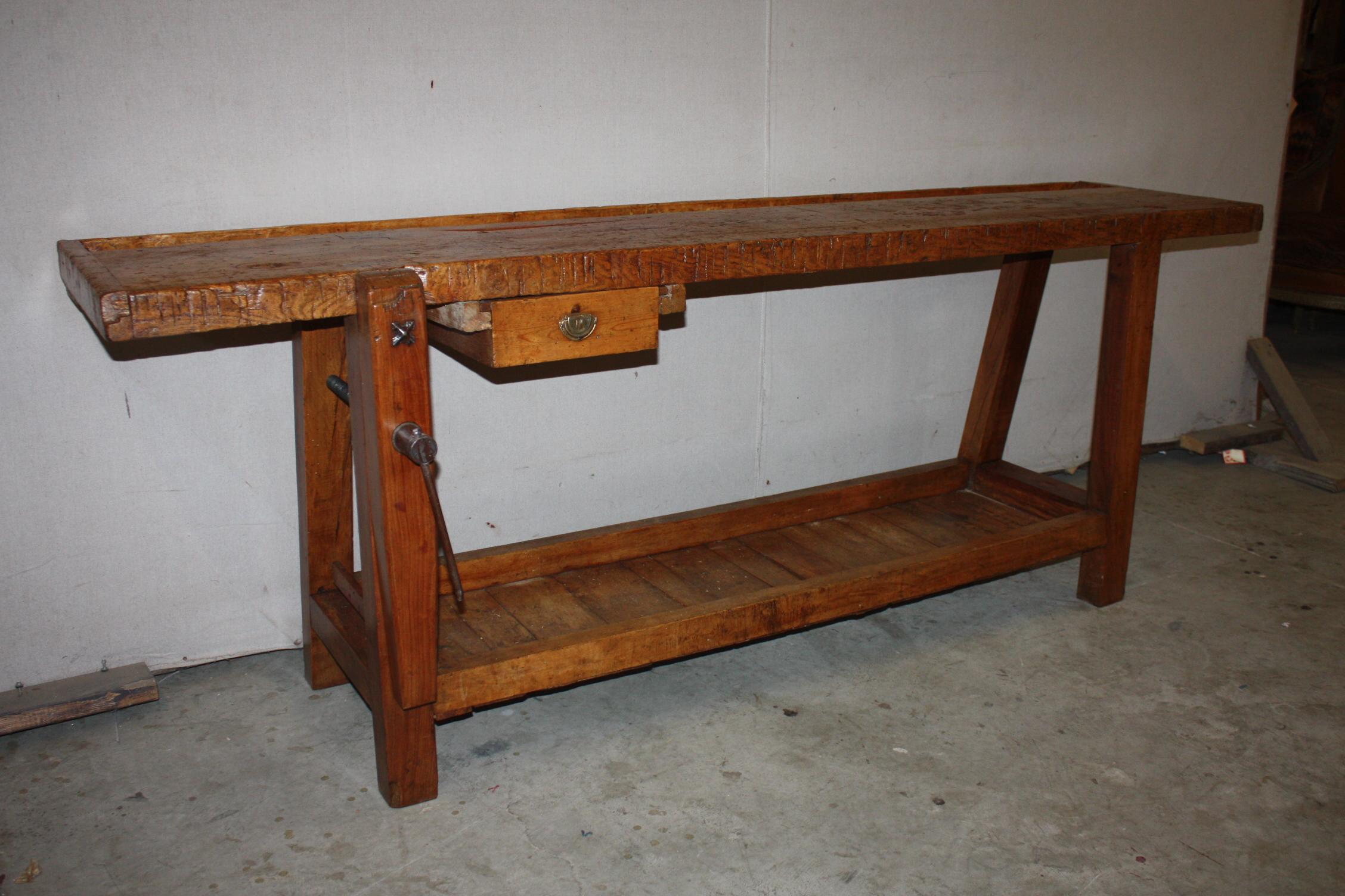 This is a very nice French workbench that dates to the mid-1800s. It has a wood vice and a single drawer. There is a trough along the back edge that is typical of workbenches of this age.