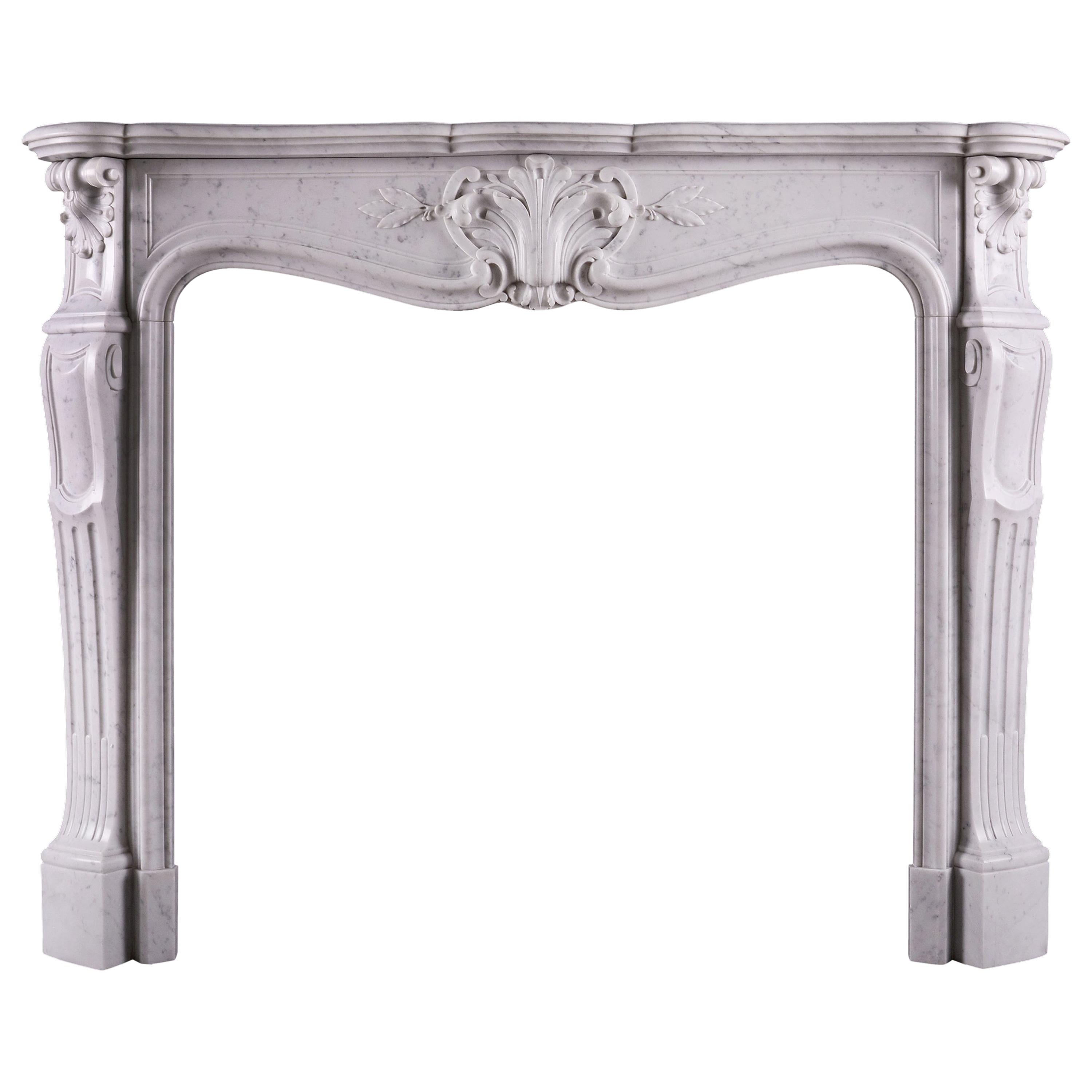 A 19th Century French Carrara Marble Fireplace in the Louis XV Style For Sale