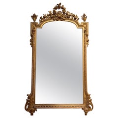 Miroir Louis XVI en bois sculpté et doré du 19ème siècle