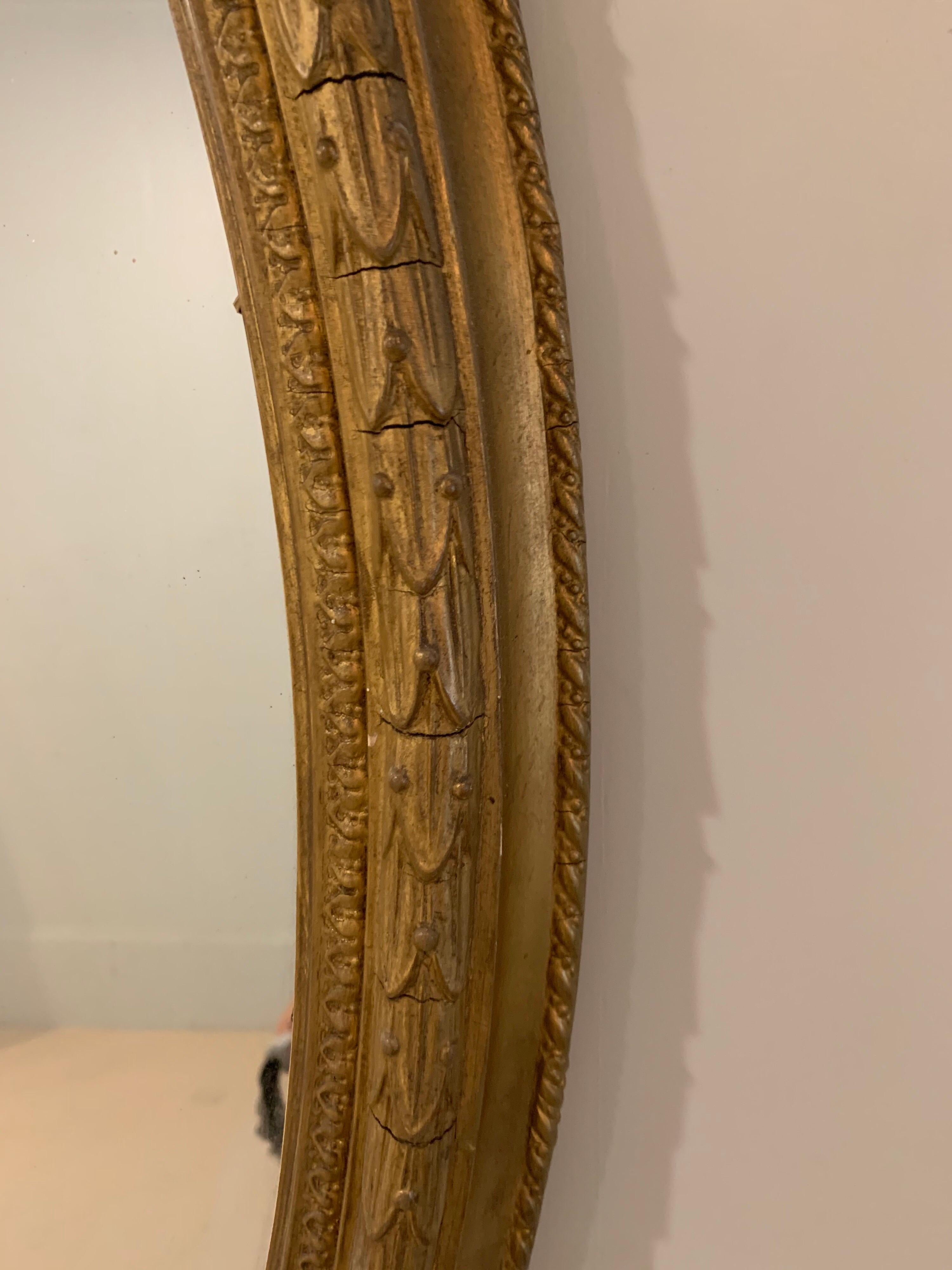 19th Century French Carved and Giltwood Oval Mirror with 3-Arm Sconce In Good Condition For Sale In Dallas, TX