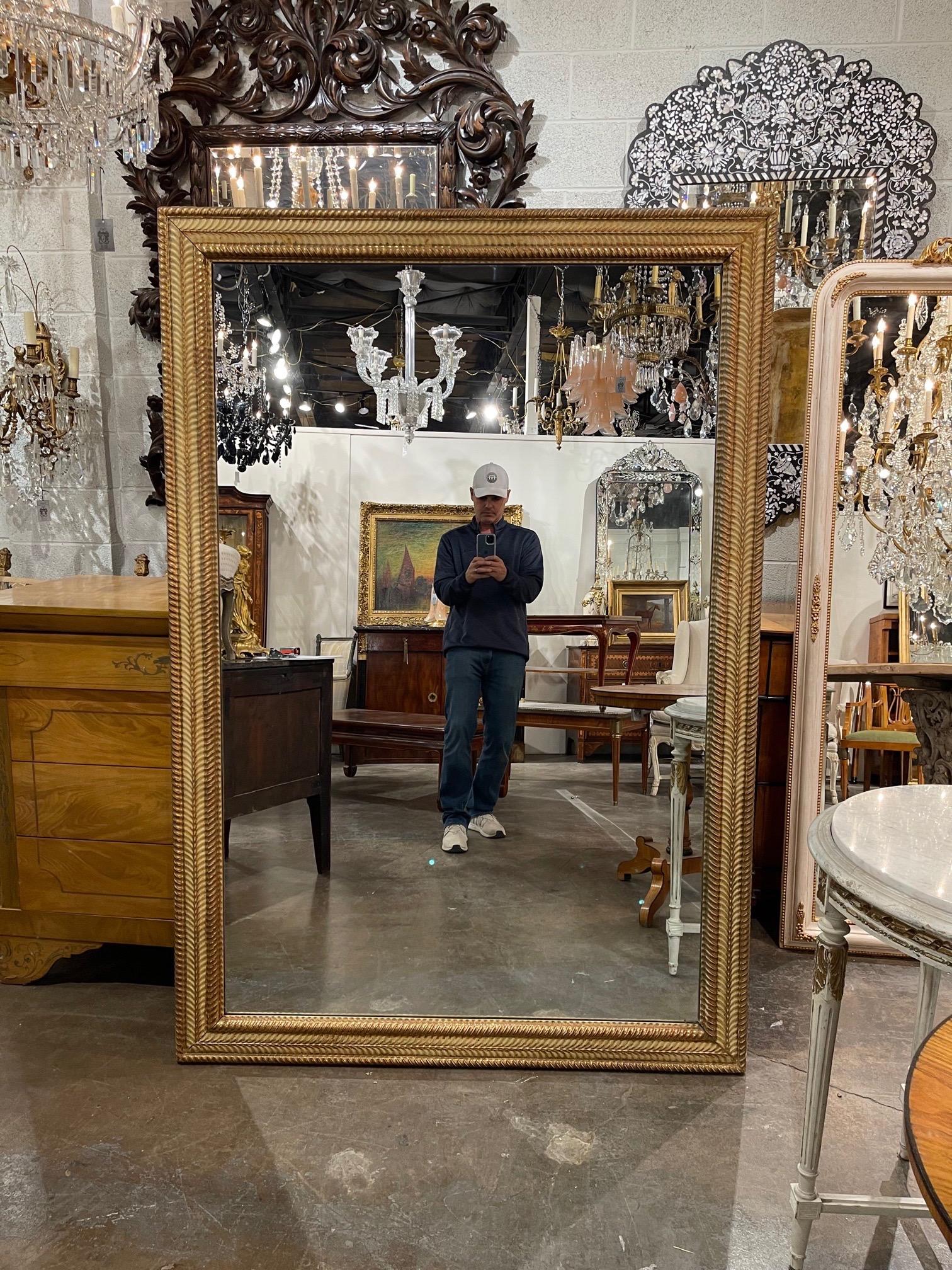Beautiful large scale 19th century French carved and giltwood transitional mirror. Exceptional carving and gilt on this piece. Very fine quality and this piece can be used in a variety of decors!!