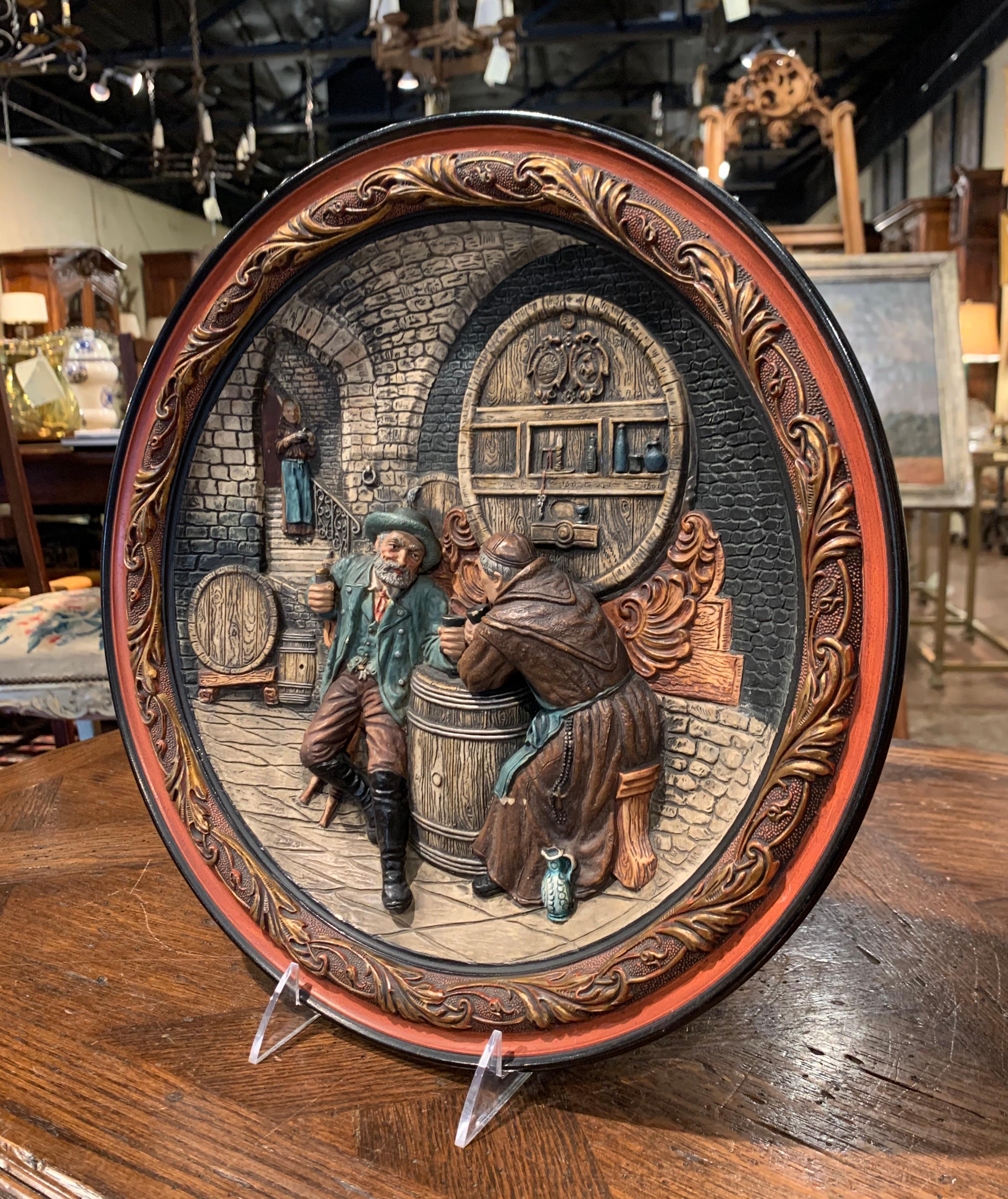Decorate a wine cellar with this whimsical antique wall plate; crafted in France circa 1890, the large platter depicts an inside 