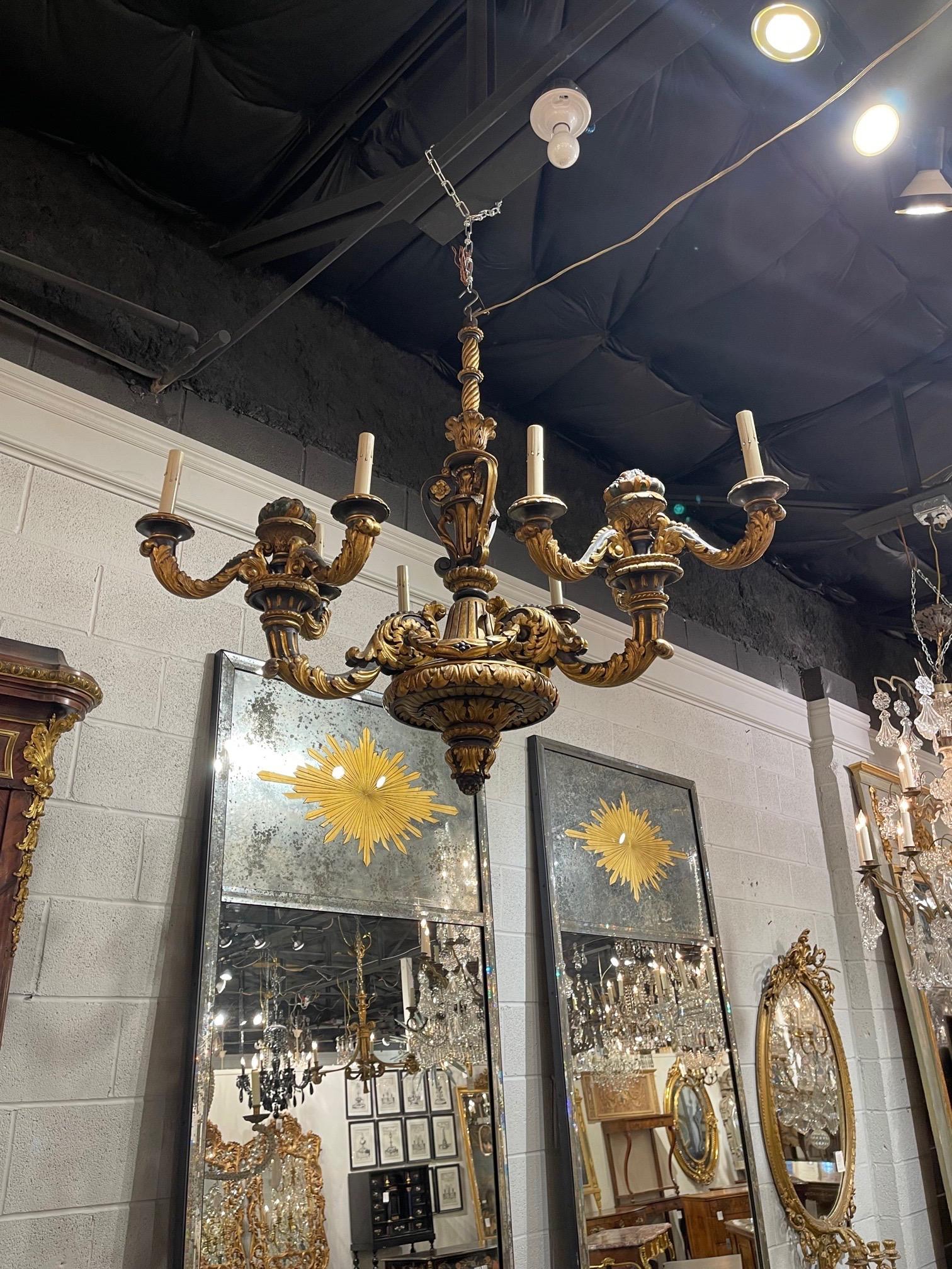Very fine 19th century French carved and poly chromed 9 light wood chandelier. Beautiful intricate carvings make this fixture extra special!