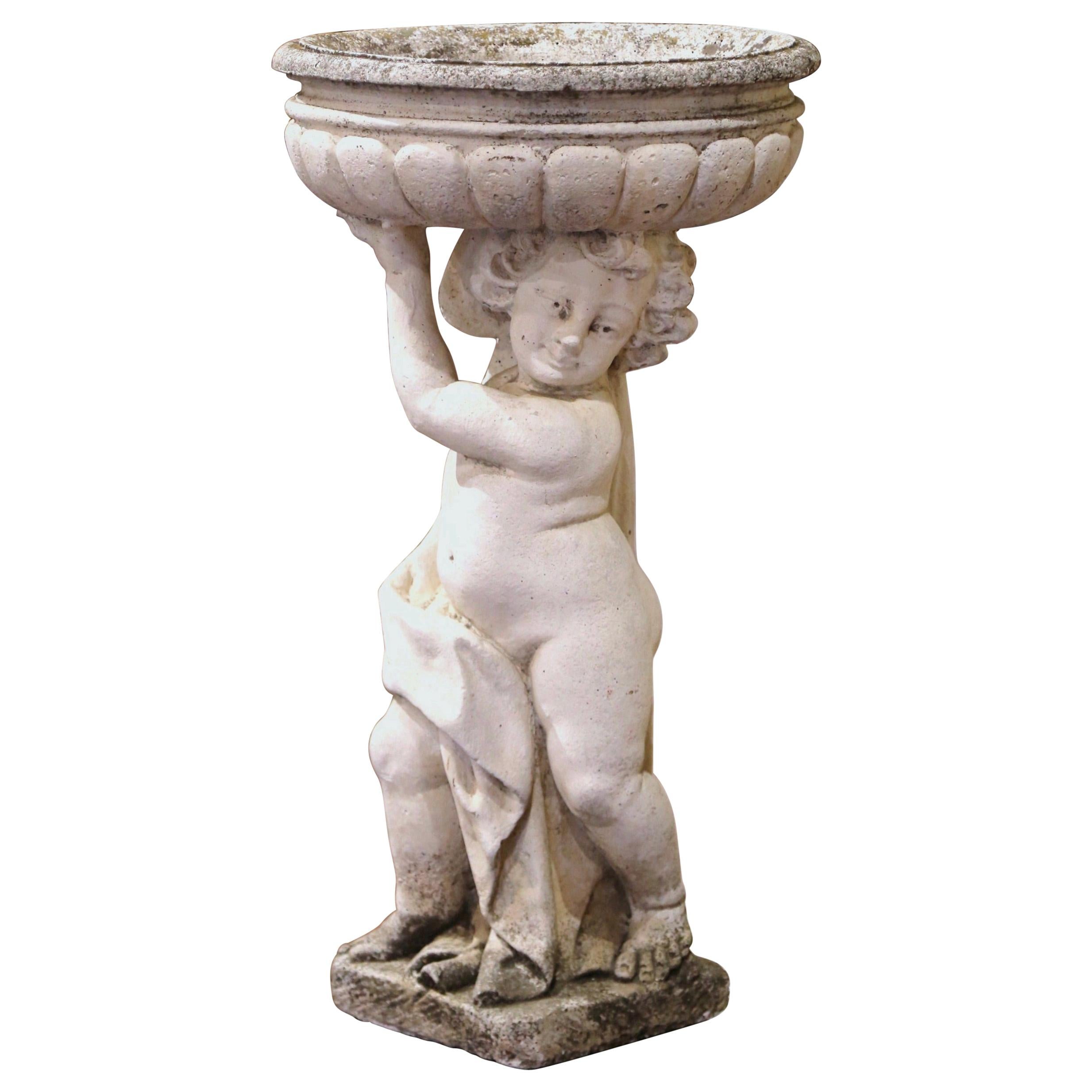 19th Century French Carved and Weathered Outdoor Stone Planter with Cherub
