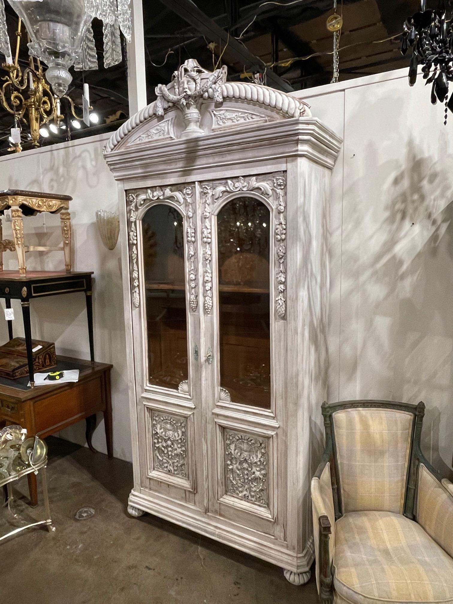 Beautiful 19th century French carved and white washed oak cabinet. Exceptional carvings and a very fine patina on this piece. Stunning!!