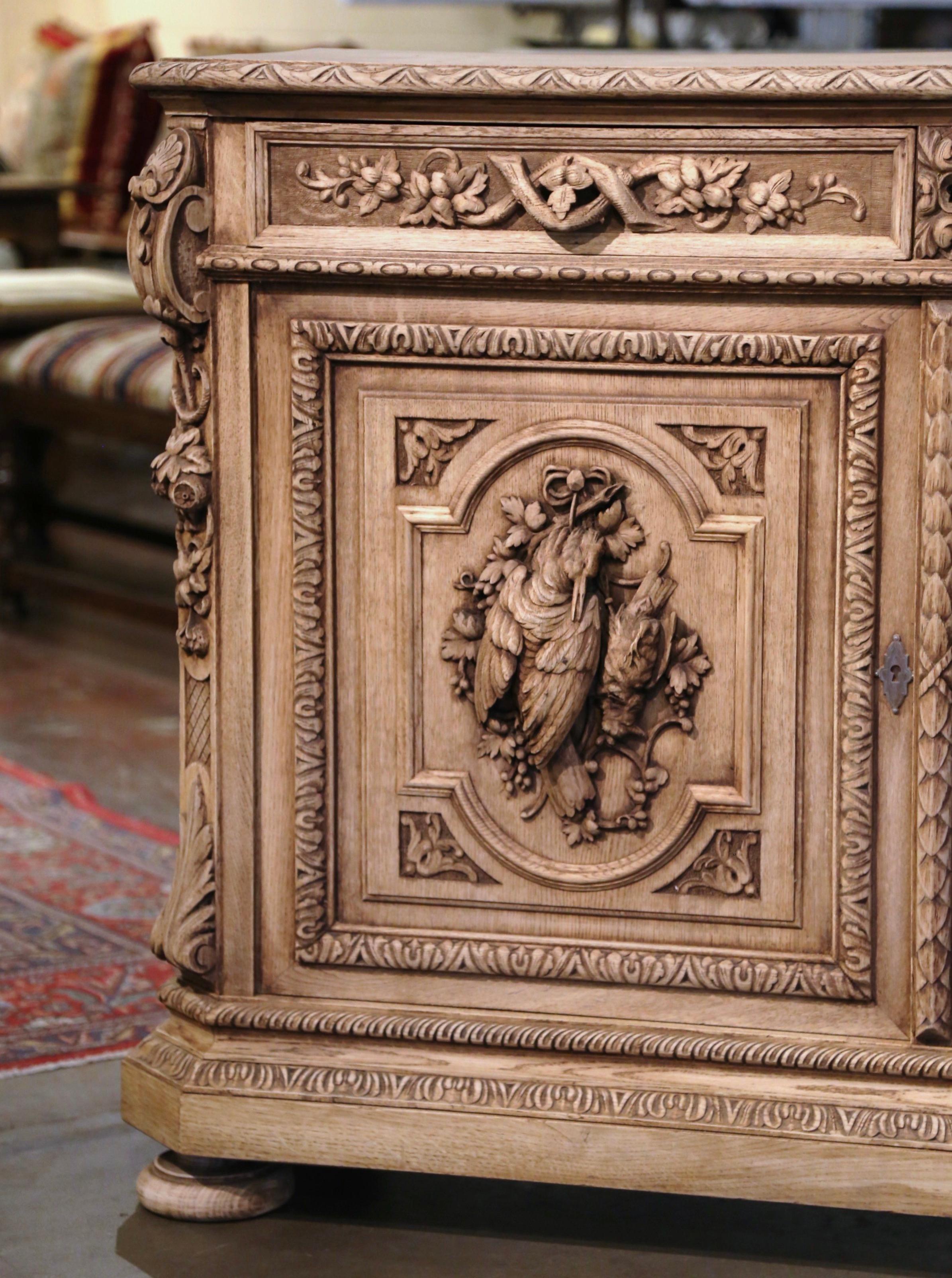 19th Century French Carved Bleached Oak Hunt Cabinet with Bird and Fish Motifs 1