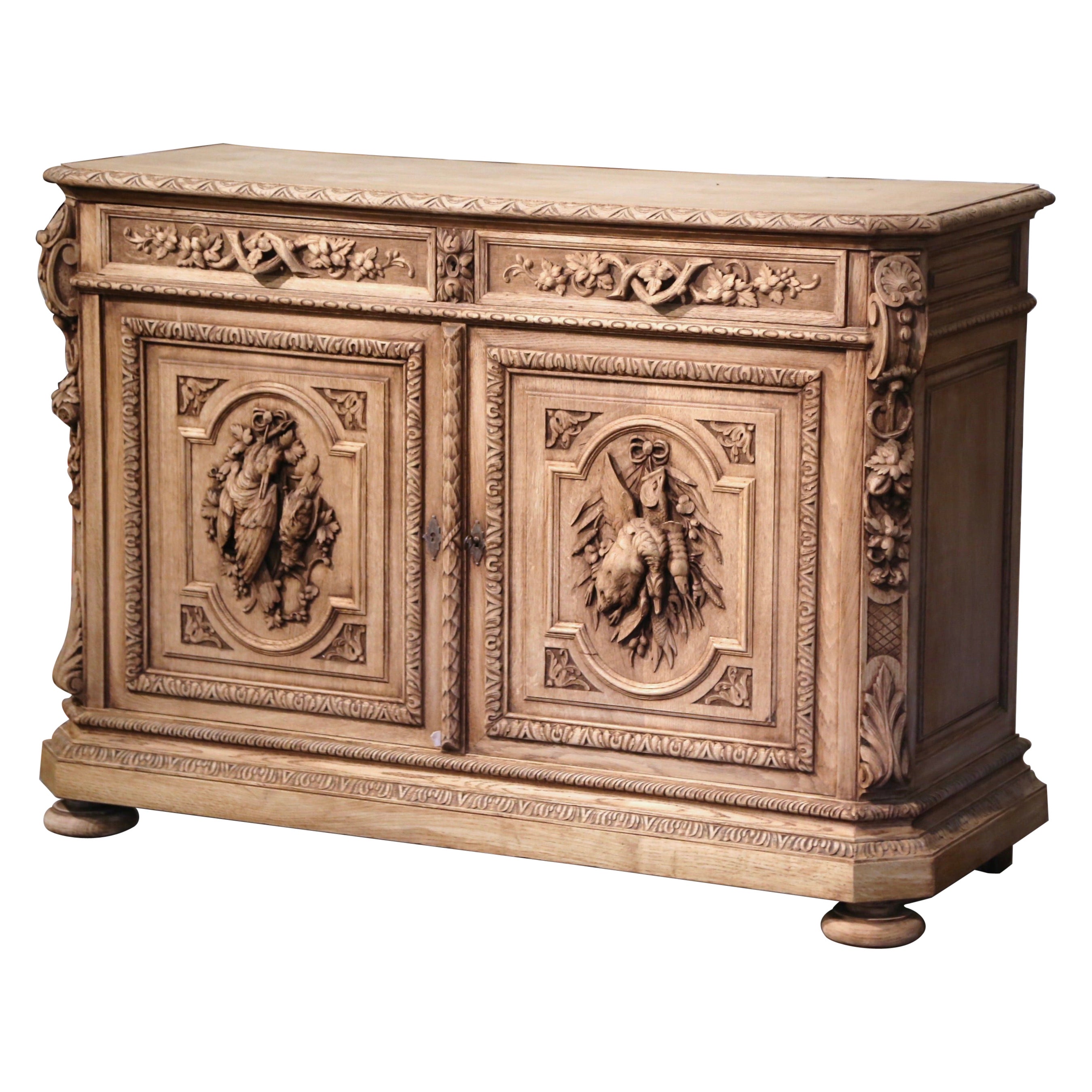 19th Century French Carved Bleached Oak Hunt Cabinet with Bird and Fish Motifs
