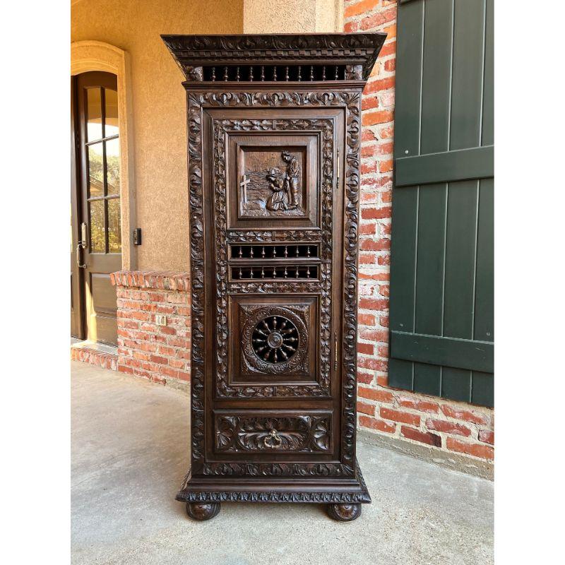 19th century French Carved Wood Bonnetiere Armoire Cabinet Brittany Breton.

Direct from France, a lovely antique French armoire or “bonnetiere” cabinet, with gorgeous hand carvings throughout.
The slender, smaller size makes a “bonnetiere”