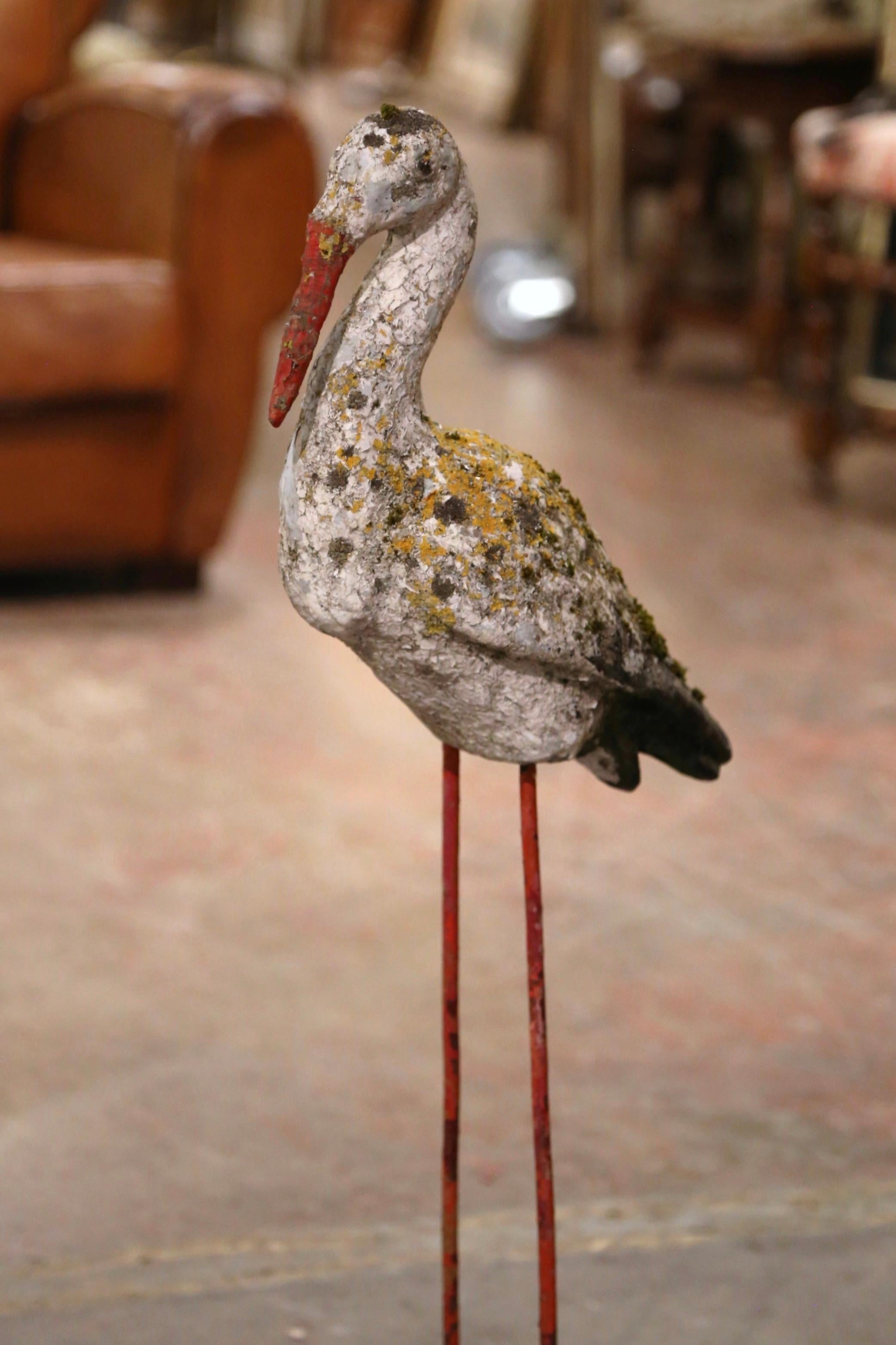 Decorate a garden or courtyard with this antique crane statue! Crafted in Normandy France circa 1870, and built of concrete, the bird sculpture stands on straight legs with feet planted firmly in grass with its head forward. The body of the crane is