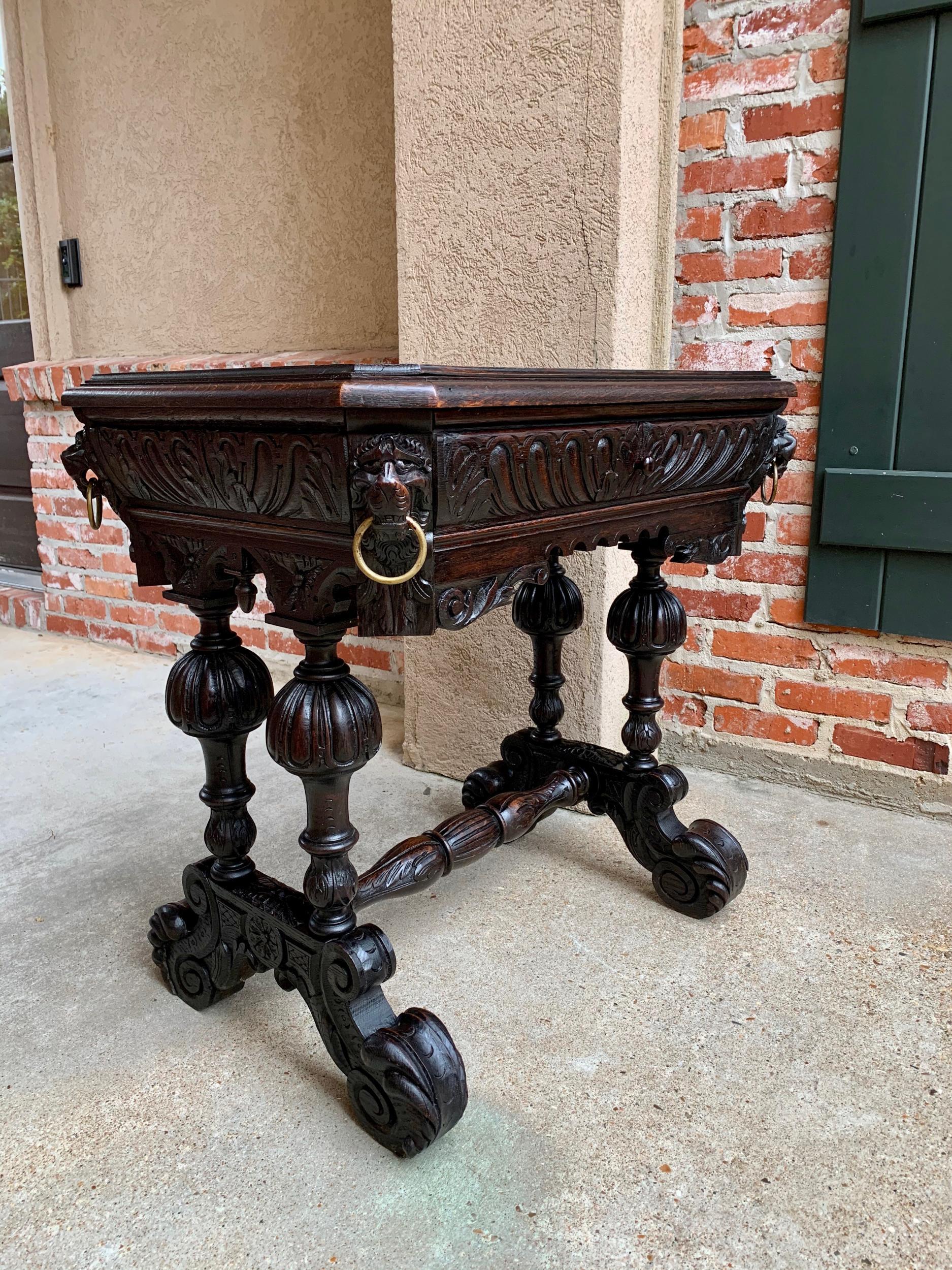 19th century French carved dark oak sofa side table small Renaissance Victorian

~Direct from France~
~An elegant antique French carved oak library table or “bureau plat” desk, very similar to a ‘dolphin’ table profile~
~Very Petite size for