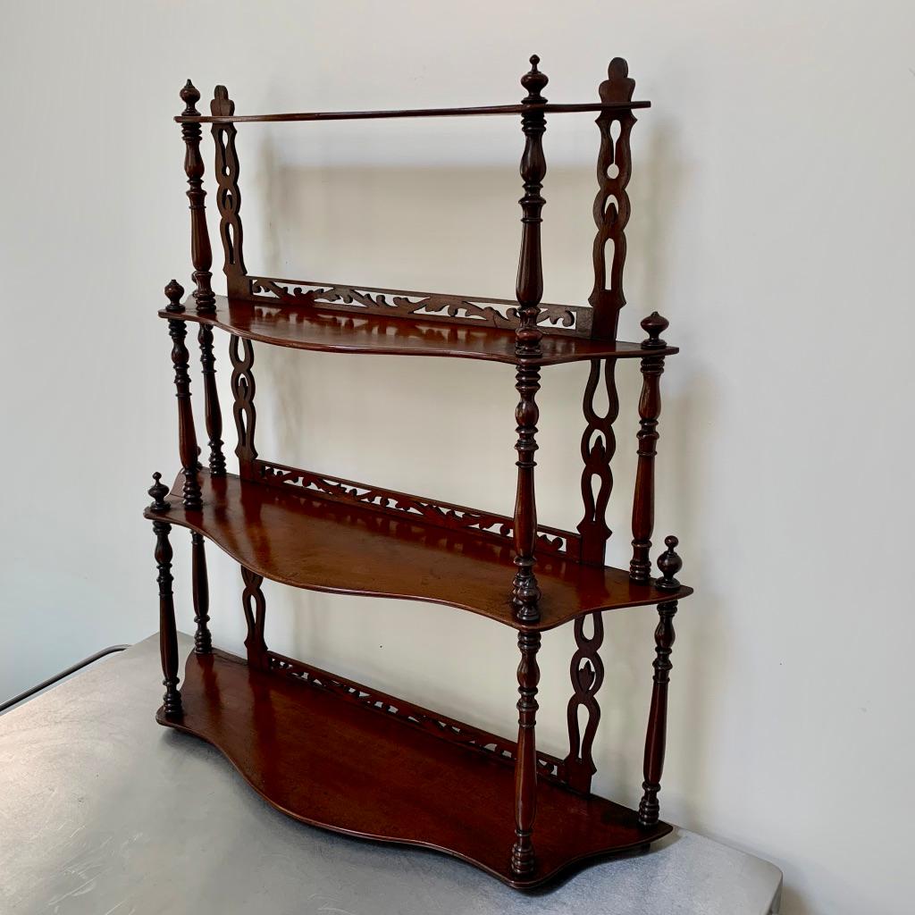 Very fine quality set of French late 19th century freestanding shelves made in solid mahogany.
Beautifully carved with the fretwork rails, fine turned columns and the shaped shelves.
There are four shelves in total and in a waterfall effect,