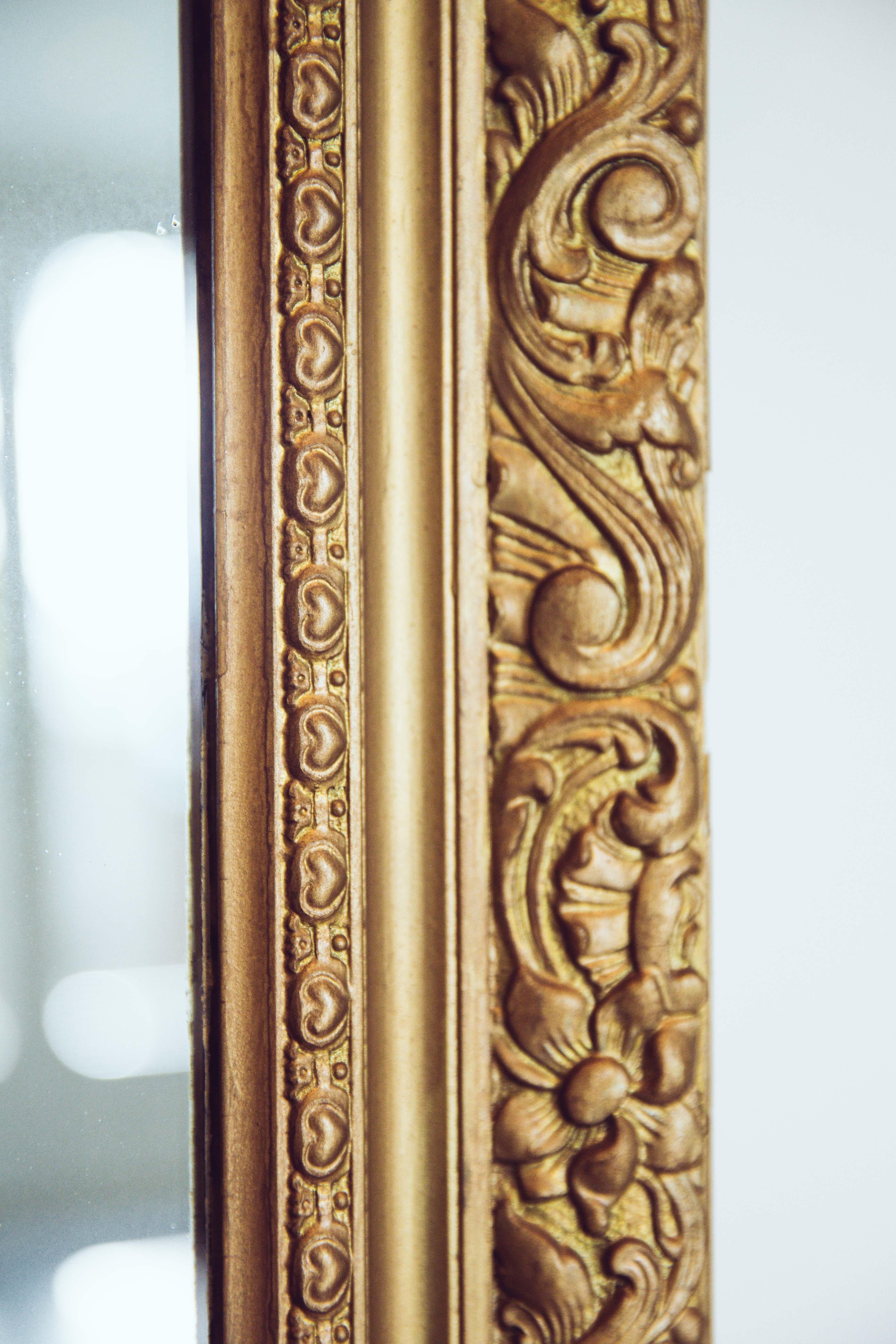 Plaster 19th Century French Carved Gilded Wood Mirror with Urn Motif Crest For Sale