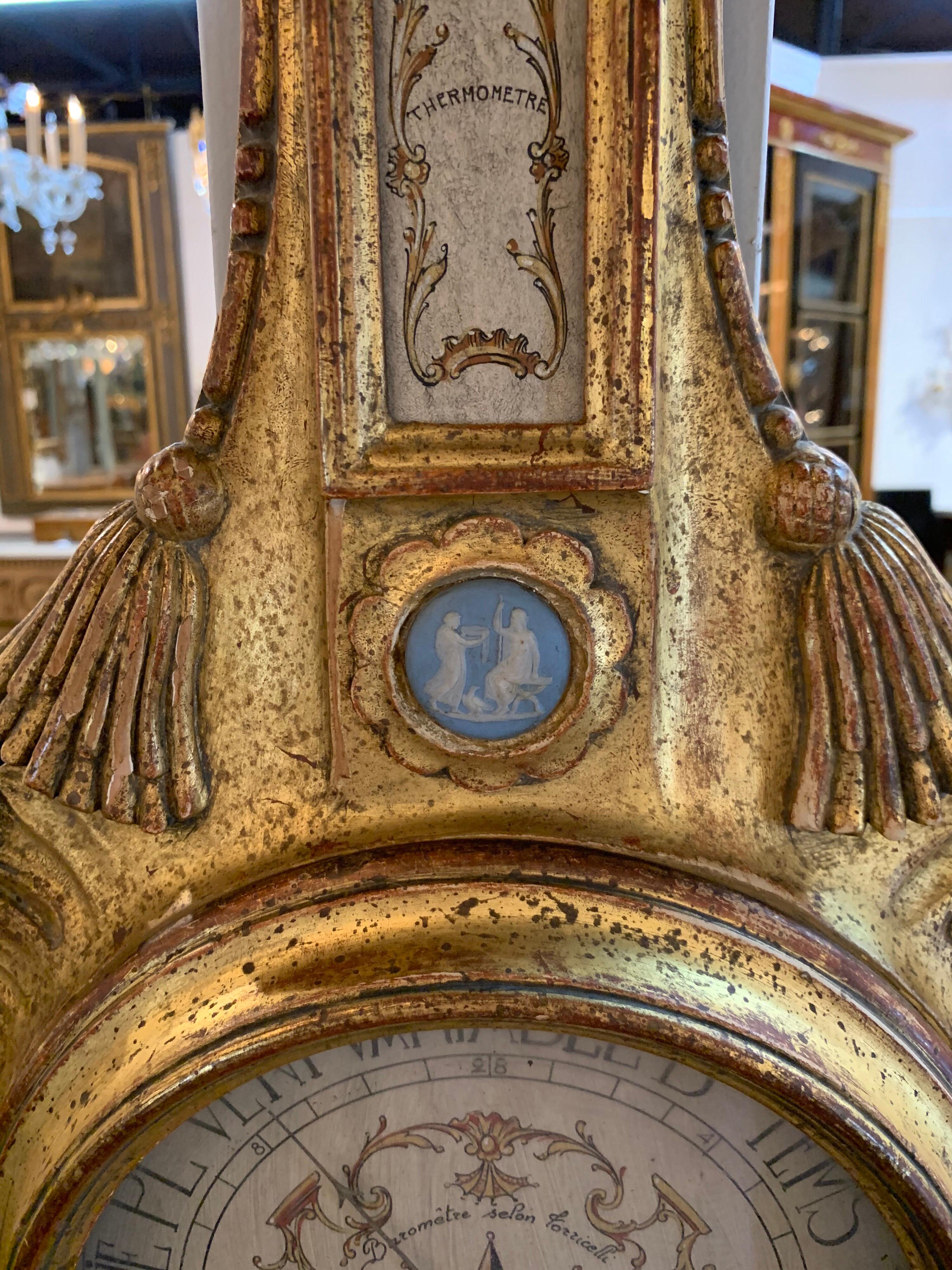 Beautiful 19th century French carved giltwood barometer. Lovely carvings of an urn with overflowing leaves and very fine gilt as well. So pretty!