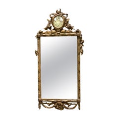 Specchio francese del XIX secolo in legno dorato intagliato con decorazione in verre églomisé