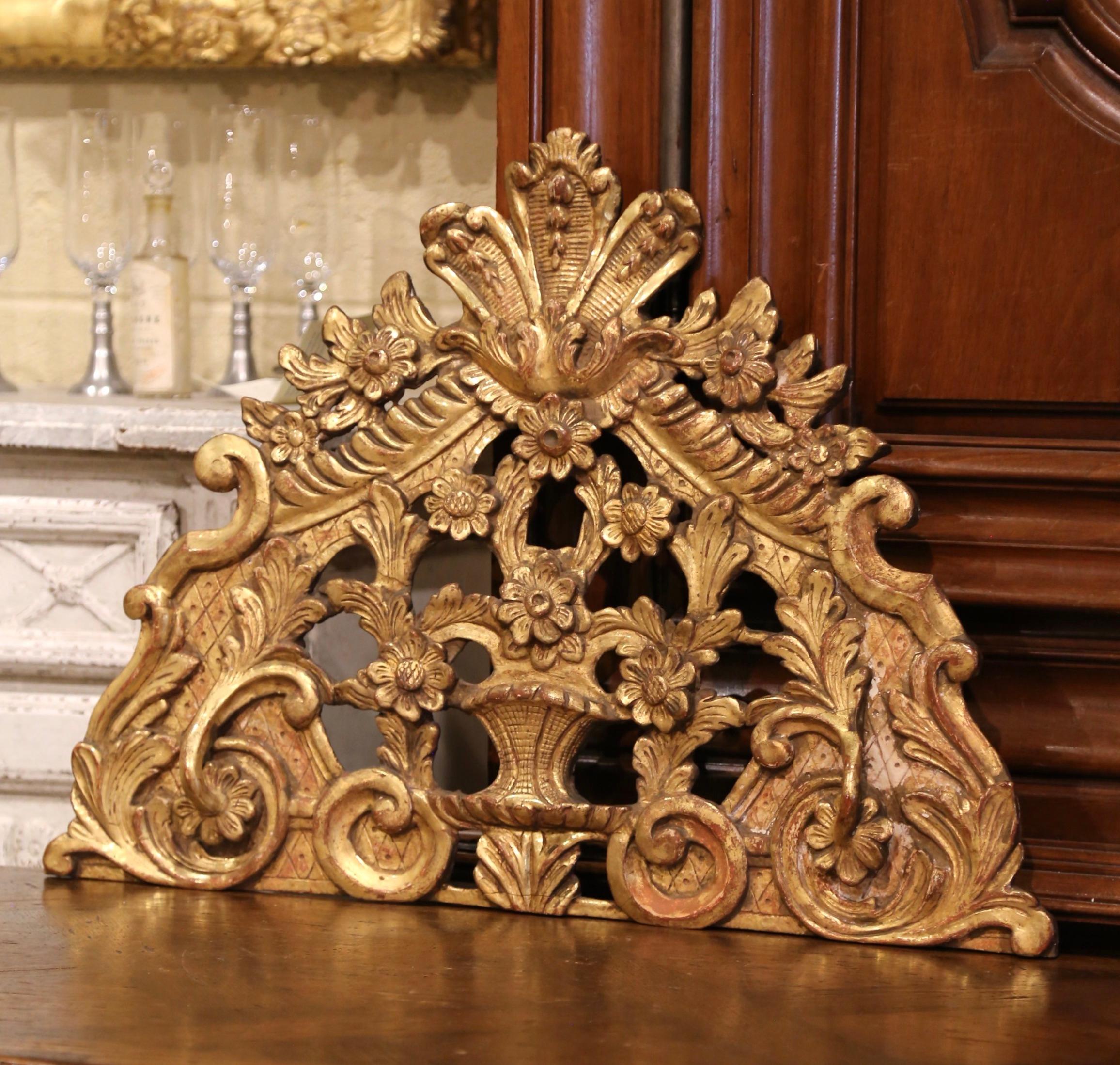 Decorate a study or an office with this antique carved gilt wood architectural sculpture. Crafted in France, circa 1850, the elegant wall-mounted crest features exquisite carvings including scrolled decor, floral and leaf motifs in high relief, and