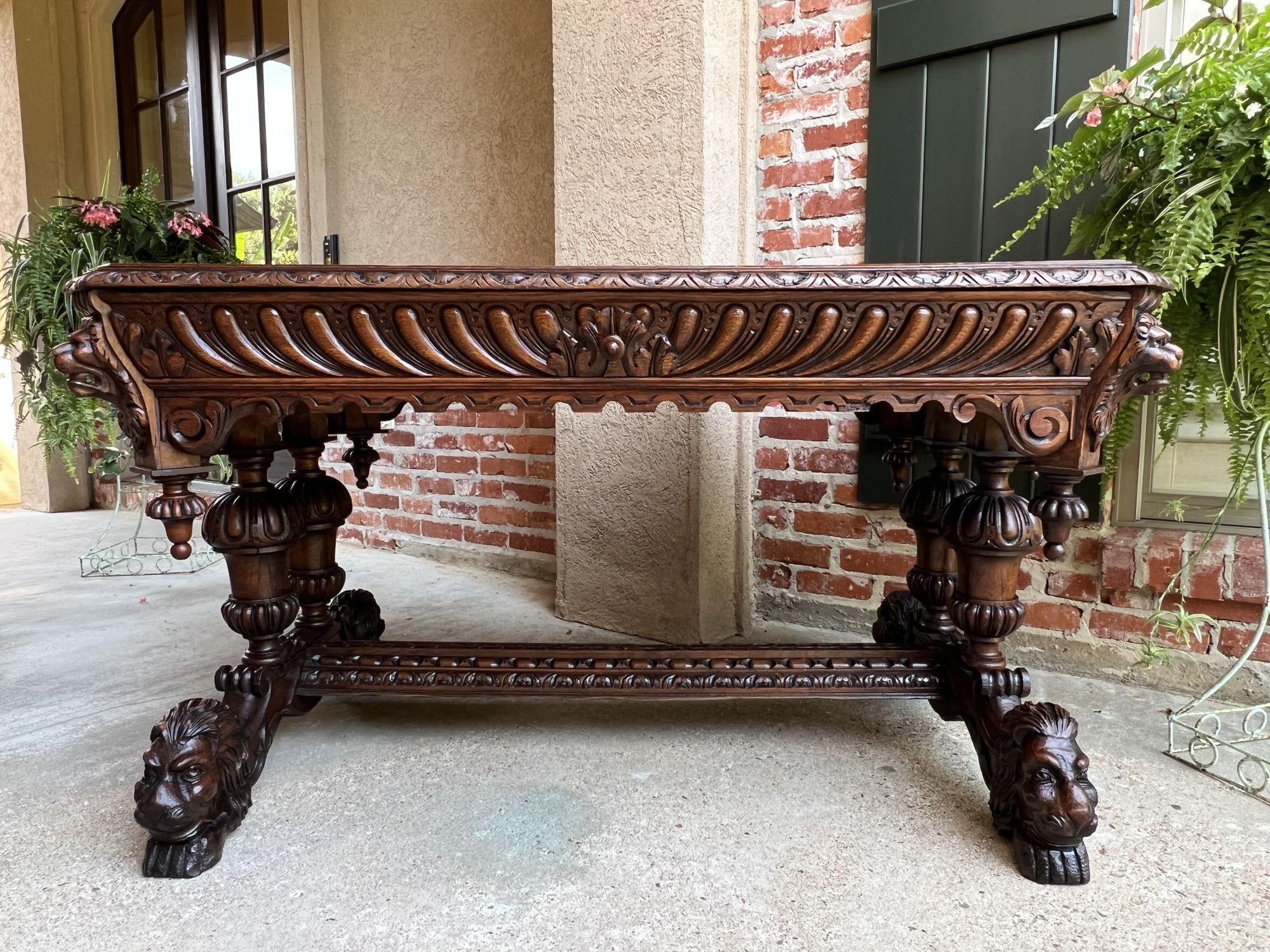 19th century French carved lion library table desk Renaissance Gothic large oak.
 
Direct from France, a superb antique carved table or 