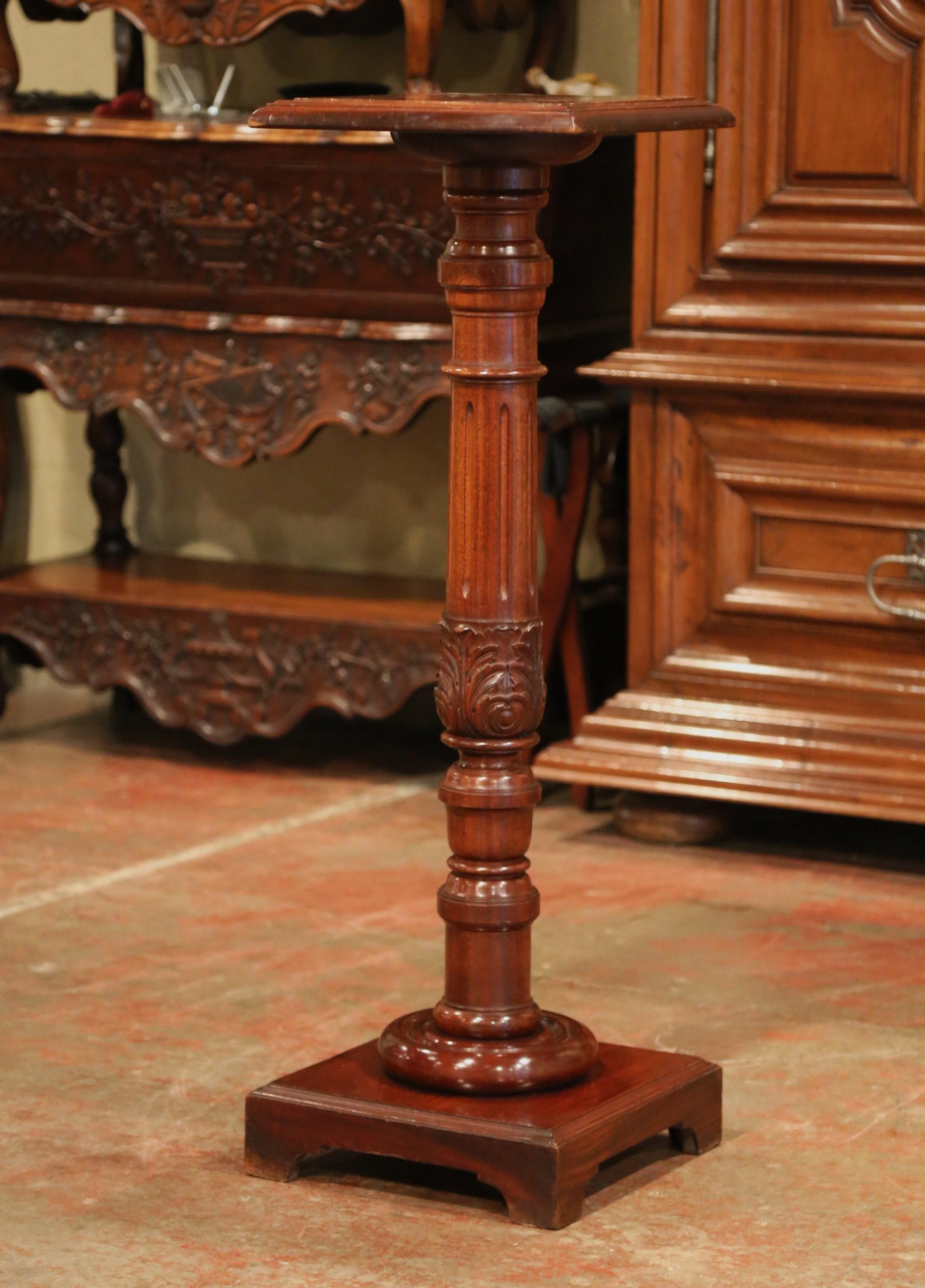 Display a bust or a flower vase on this elegant antique fruit wood pedestal column. Crafted in Southern France, circa 1880, the versatile, tall column features a turned stem decorated with carved acanthus leaves over a square base with decorative