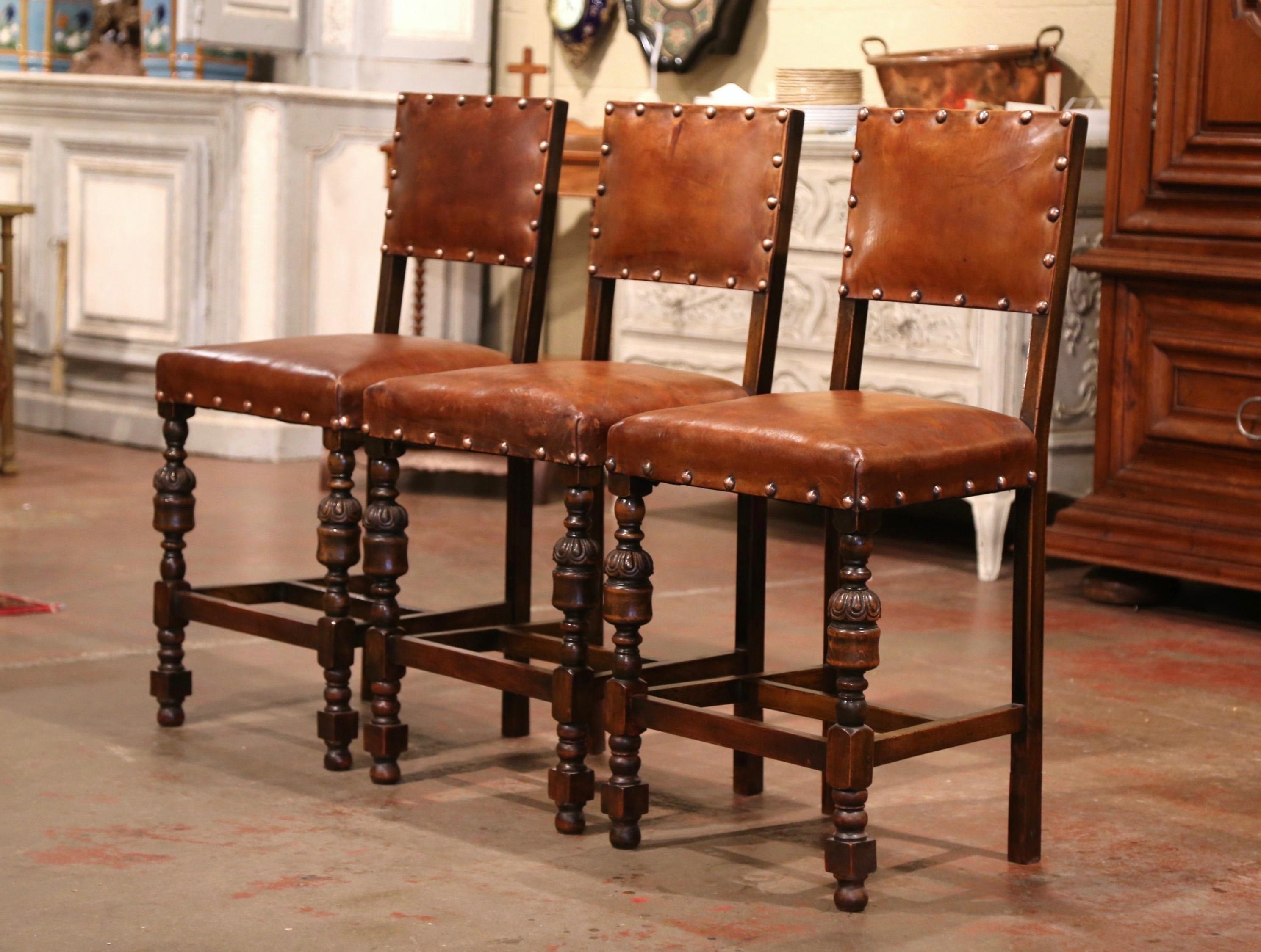 Add a Gothic look to your bar or kitchen counter with this elegant set of antique stools. Crafted in France circa 1880, the traditional Henri II style bar stools are the perfect height for a 36 to 38