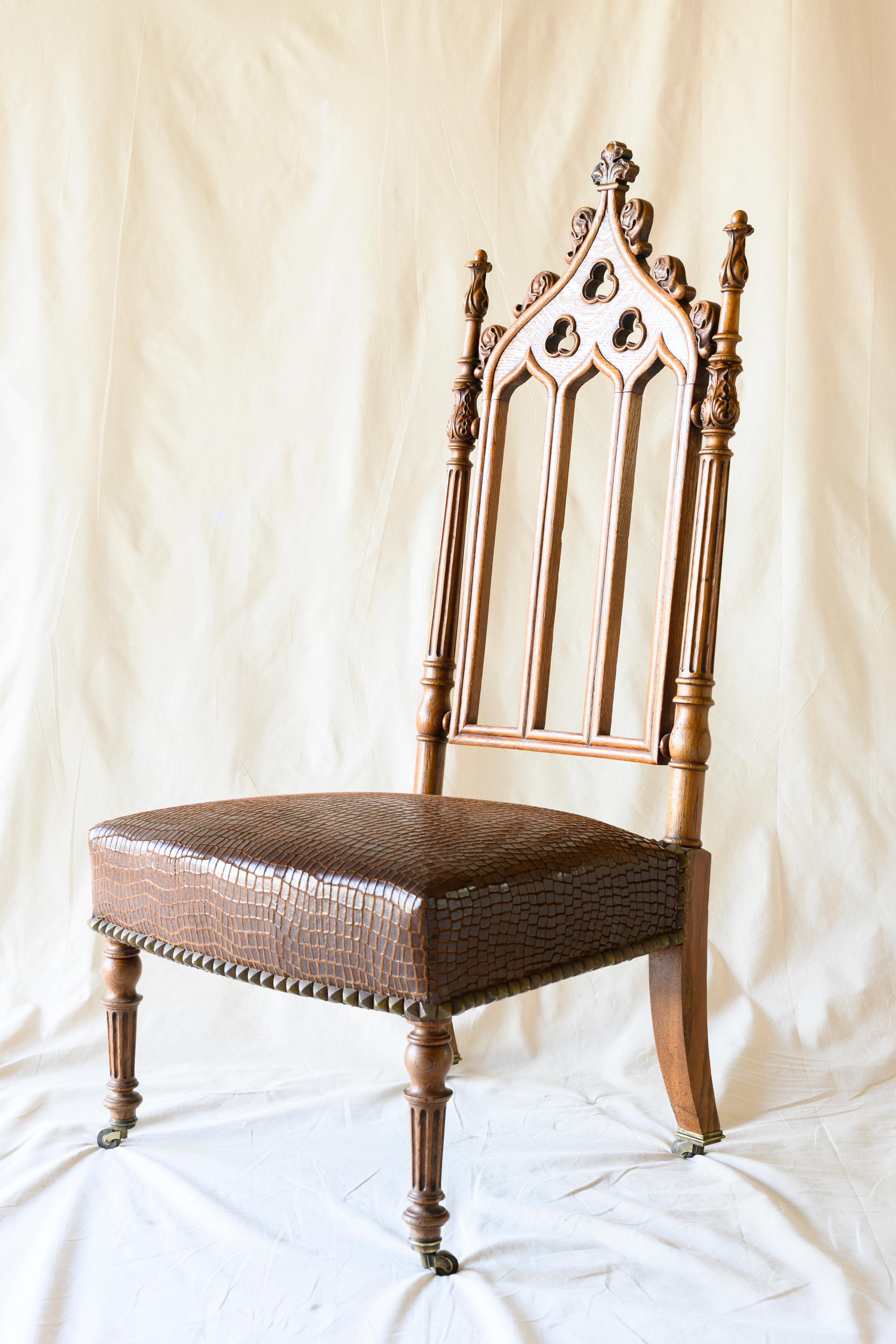 Gothic 19th Century French Carved Oak Cathedral Style Chairs, a Pair