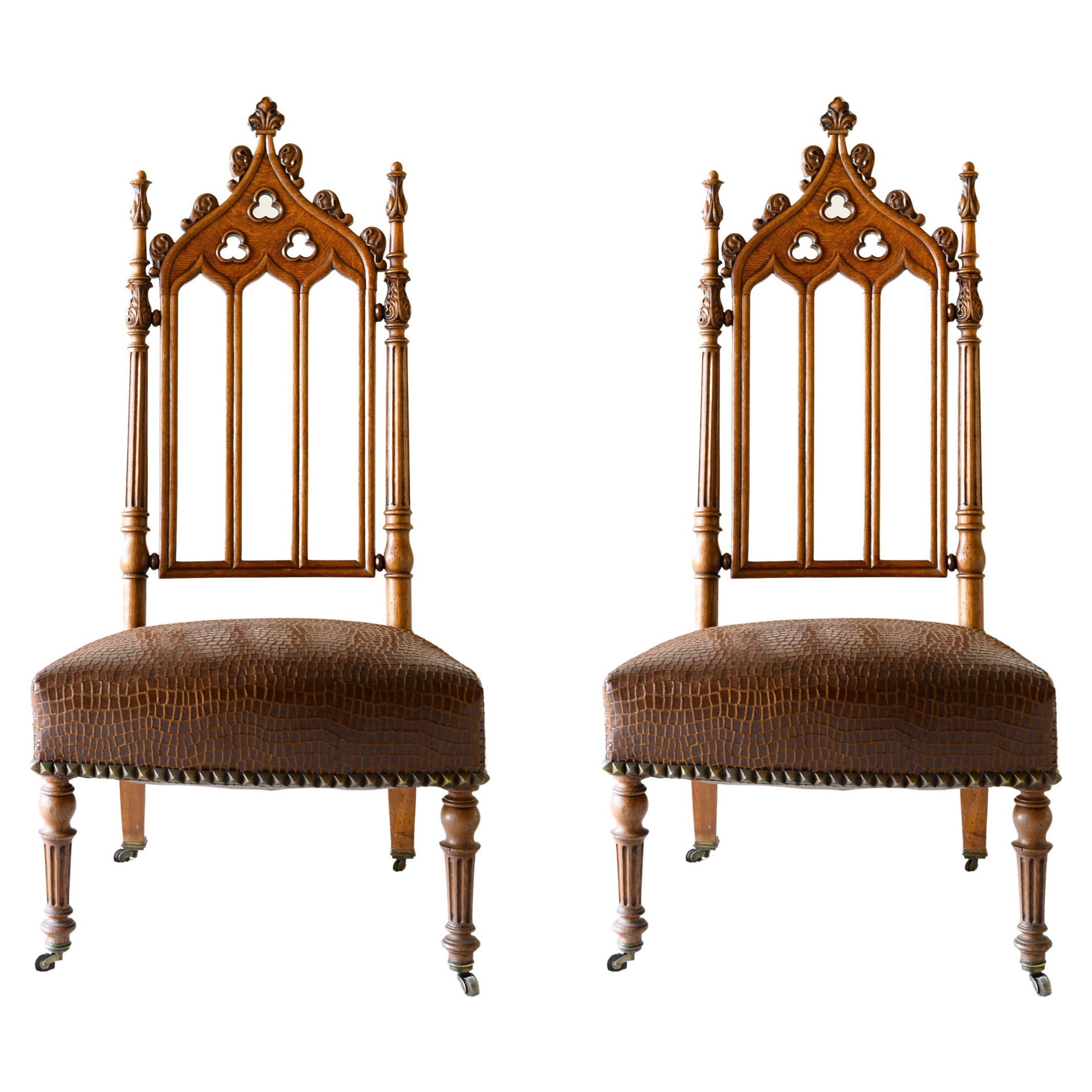 19th Century French Carved Oak Cathedral Style Chairs, a Pair