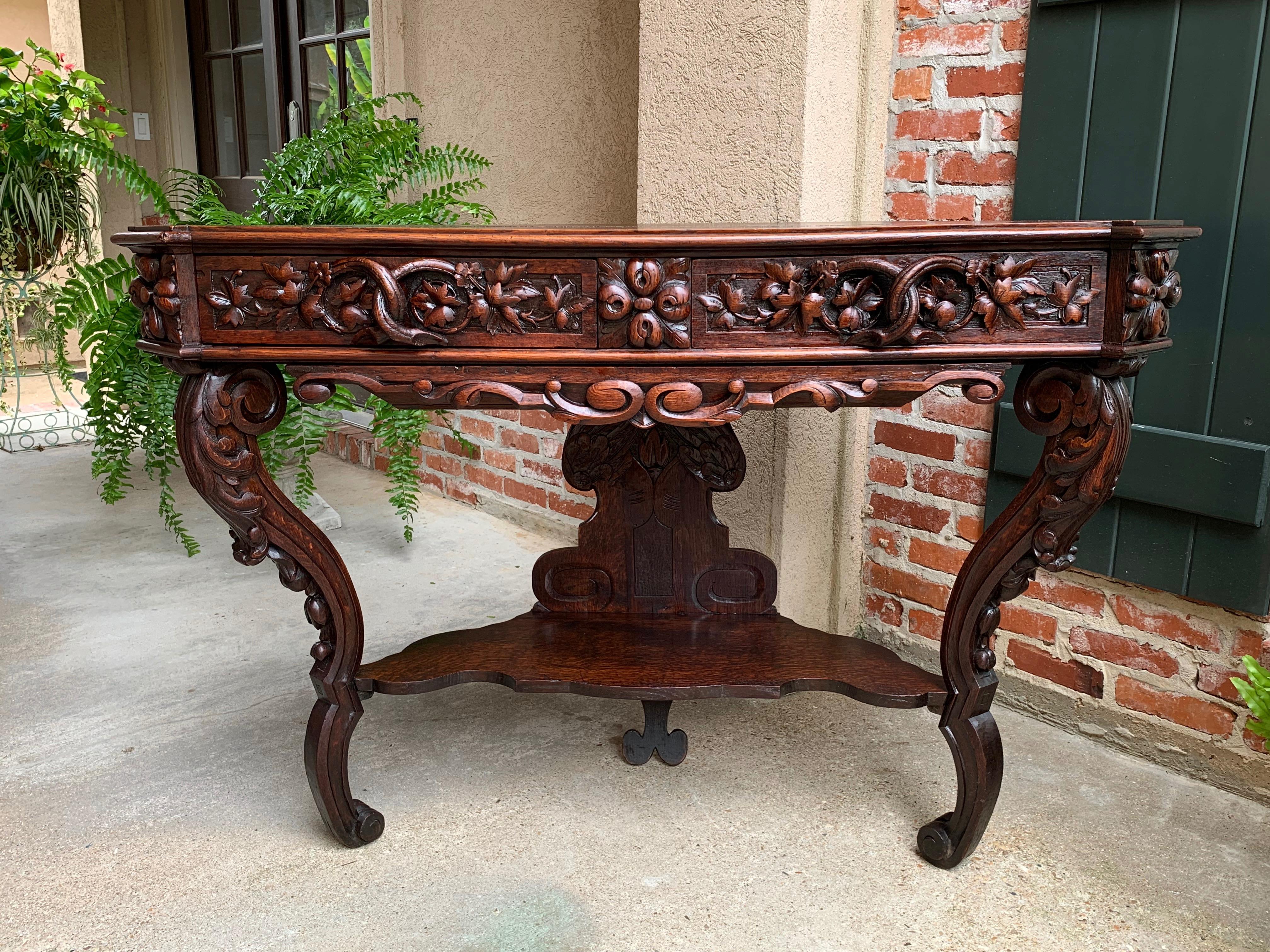 19th century French carved oak console sofa foyer table sideboard Black Forest

~Direct from France~
~Stunning hand carving on this oversized 19th century French table/console!~
~Large, open carved branches form both of the drawer pulls, set in the
