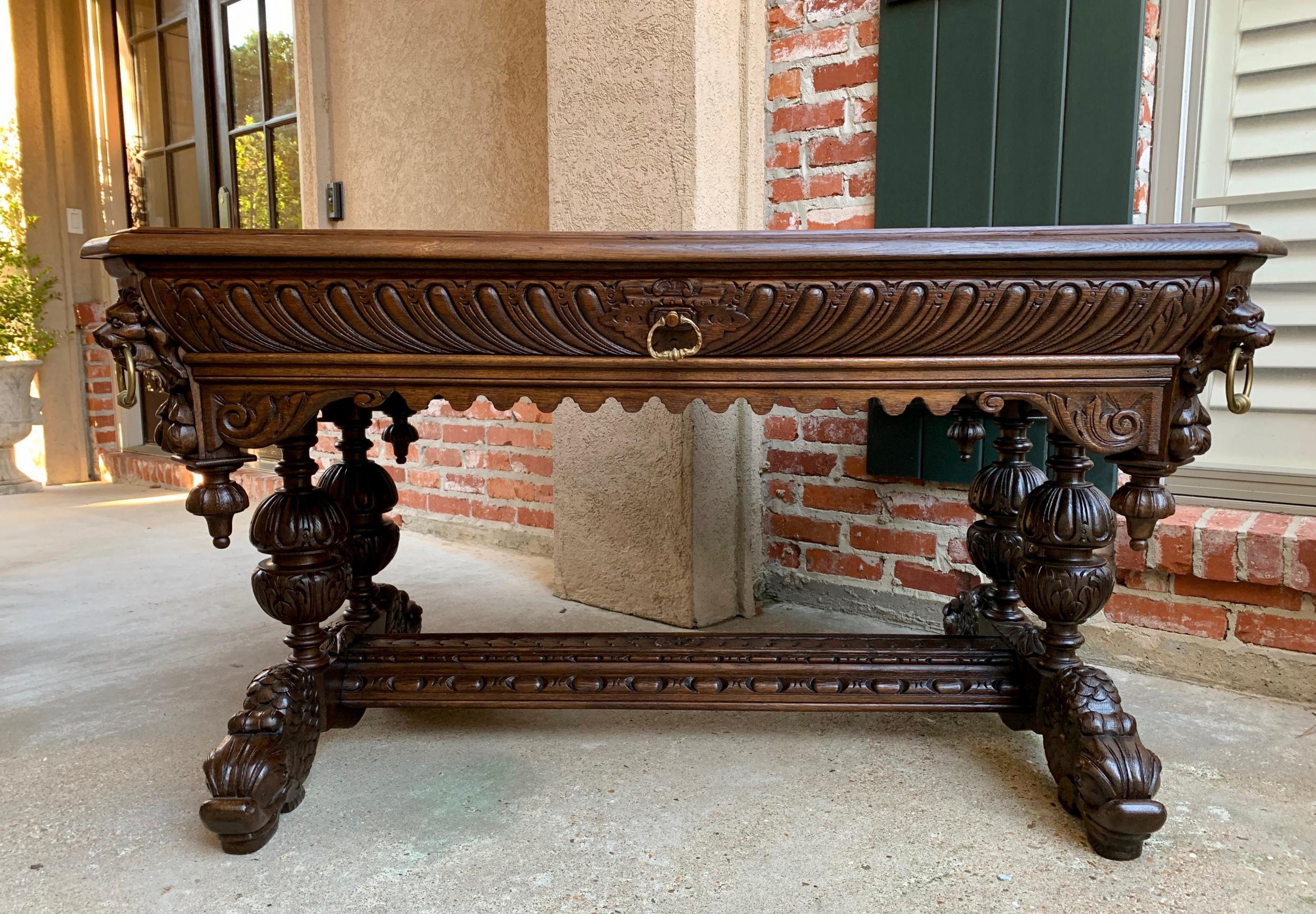 

19th century French Carved Oak Dolphin Library Table Desk Renaissance Gothic

~Direct from France~
An elegant antique FRENCH carved LIBRARY TABLE or 