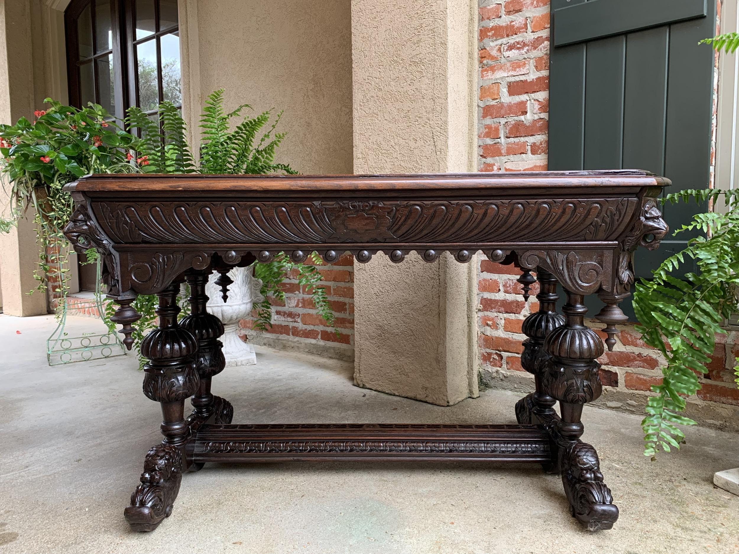 19th century French carved oak dolphin library table desk Renaissance Gothic

~Direct from France~
An elegant antique French carved library table or 