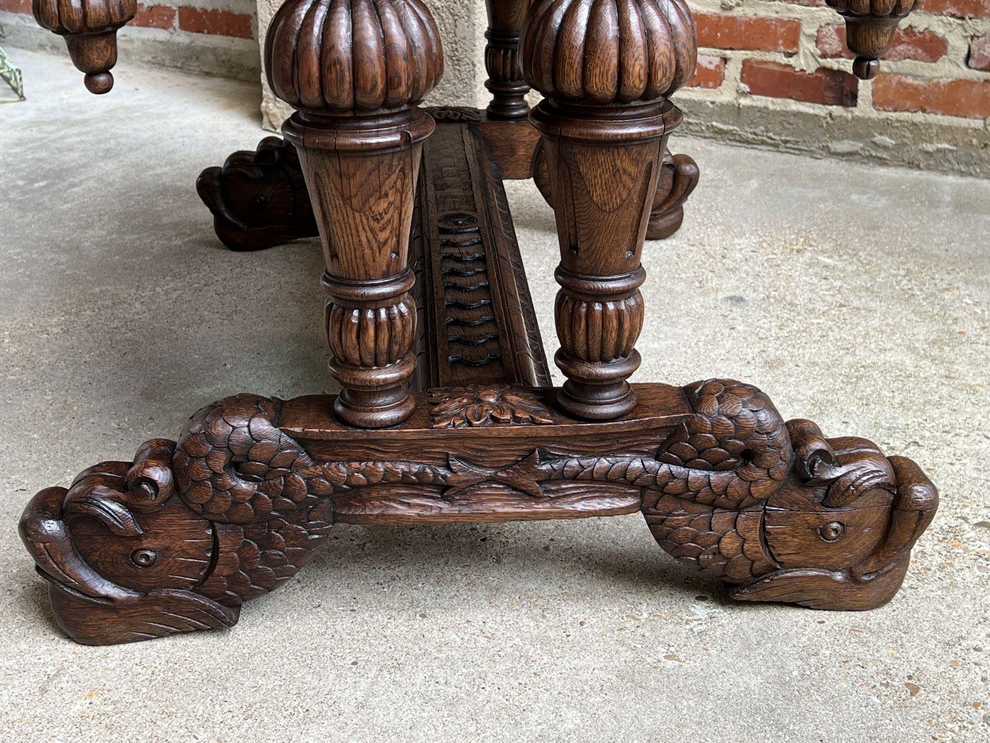 Fine XIX secolo Antique French Carved Oak Dolphin Library Table Desk Renaissance Gothic c1890 in vendita