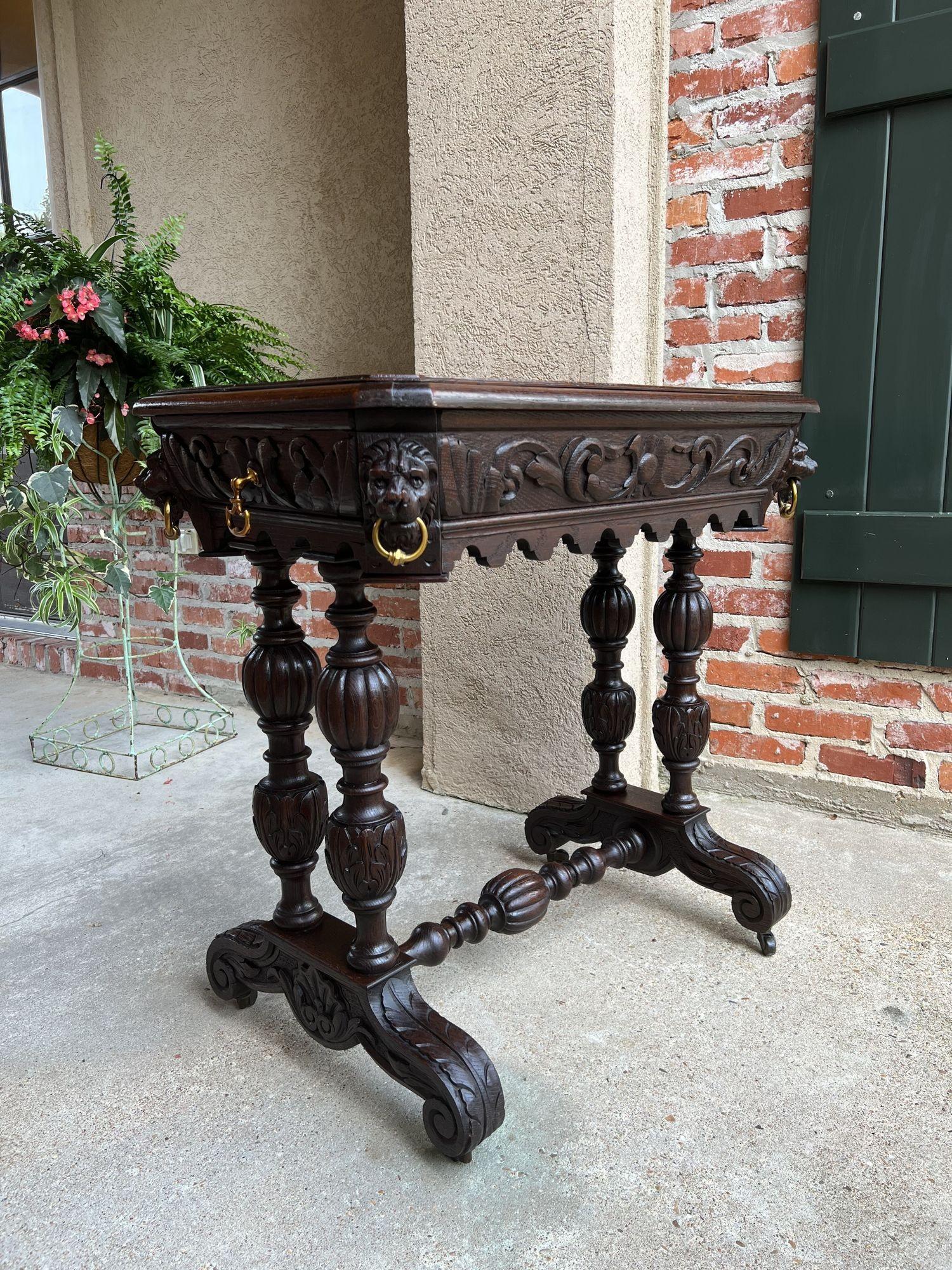19th century French Carved Oak Dolphin Library Table Petite Desk Renaissance.
 
Direct from France, an elegant, and petite, antique French carved library table or 