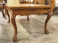19th Century French Carved Oak Draw Leaf Table with Large Lion Paw Feet