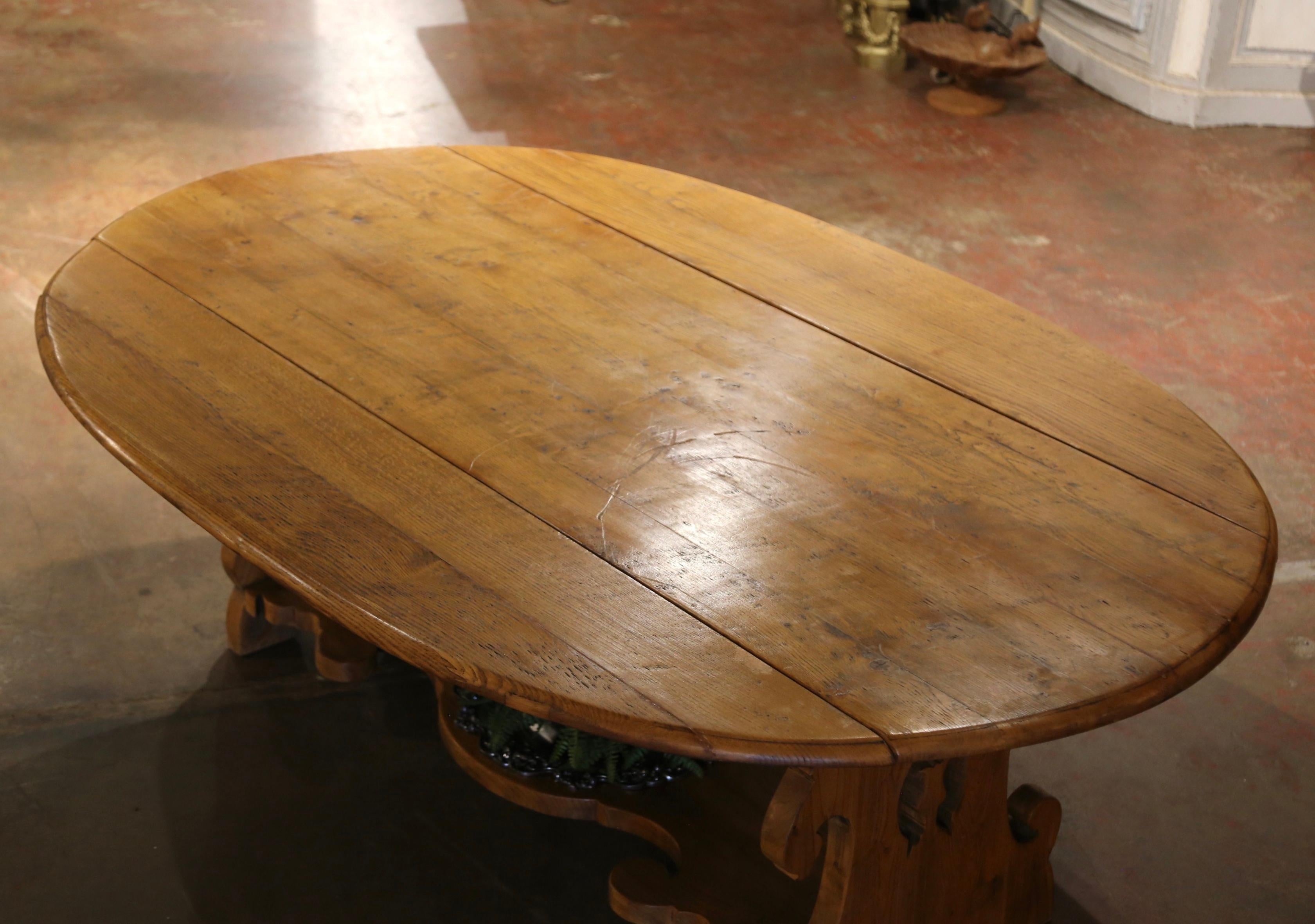 Louis XIII 19th Century French Carved Oak Drop-Leaf Oval Table on Trestle Base