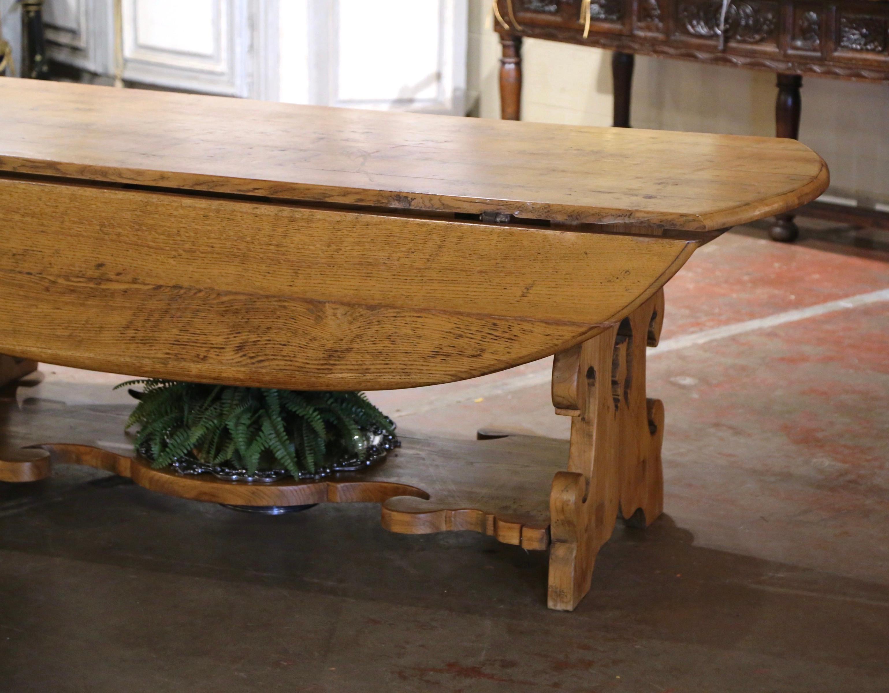 Hand-Carved 19th Century French Carved Oak Drop-Leaf Oval Table on Trestle Base