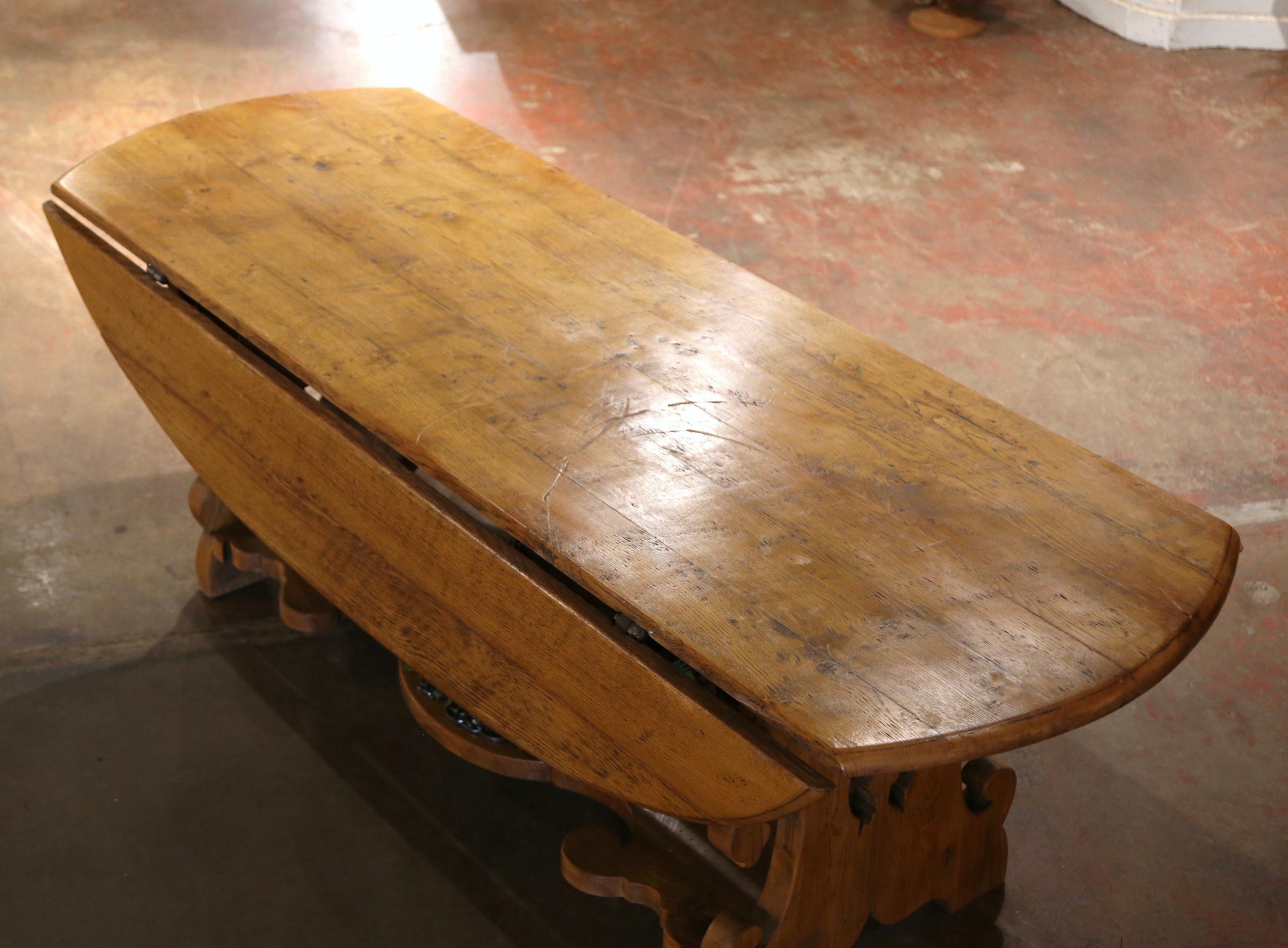 19th Century French Carved Oak Drop-Leaf Oval Table on Trestle Base In Excellent Condition In Dallas, TX