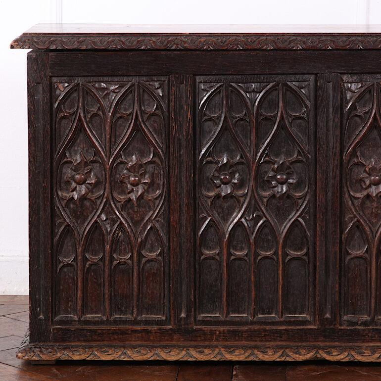 Small French gothic coffer from France the panels with highly-carved gothic arch / tracery details, the hinged top opening to allow storage.
