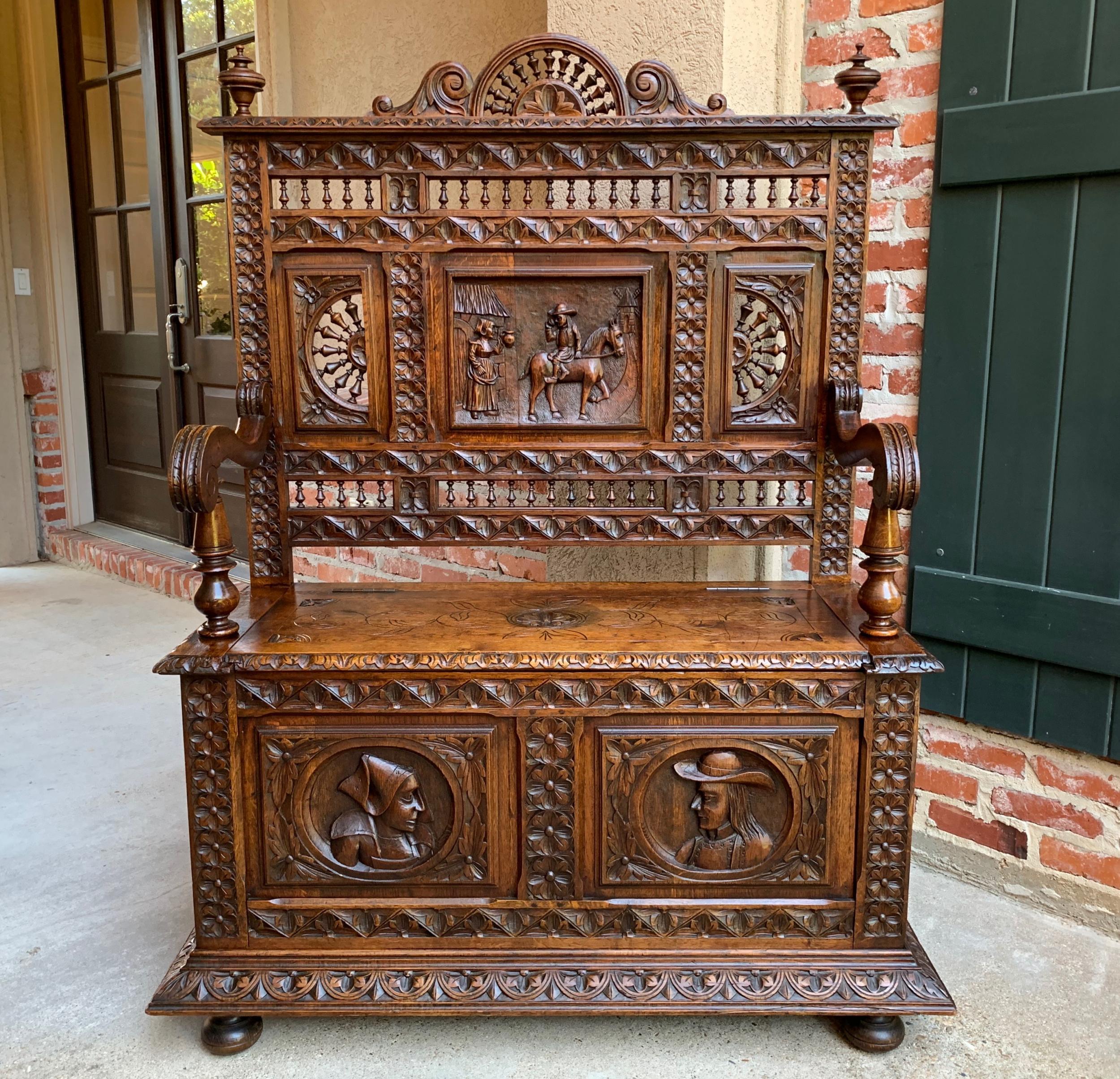 19th century French carved oak hall bench Breton Brittany Pew Banquette

~Direct from France~
~Ornately hand carved antique French hall bench in an extremely versatile small size!~
~Highly carved and spindled back, with a detailed carved panel