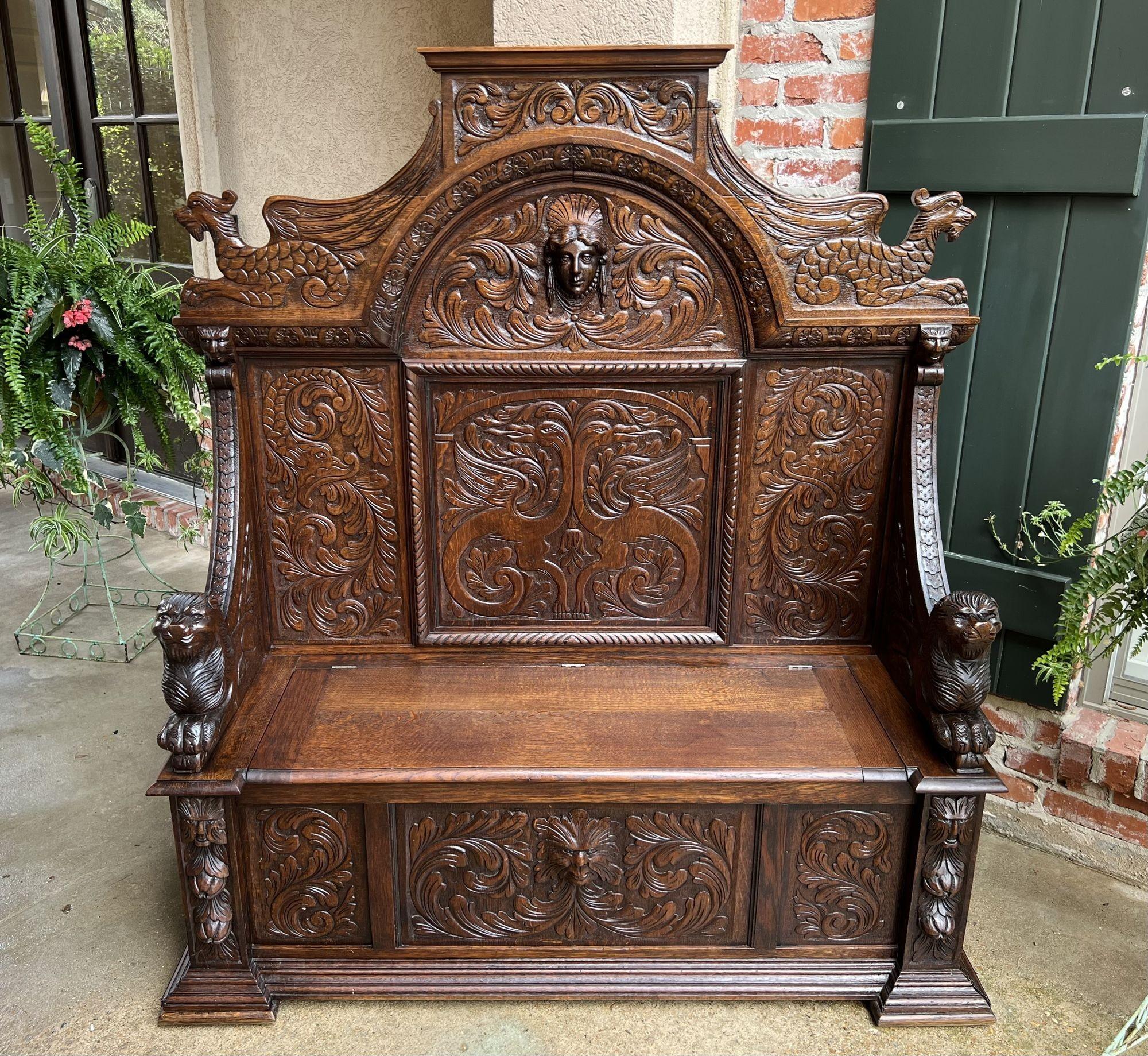 19th Century French carved oak hall bench trunk chest renaissance gothic settle.
 
Direct from France, a massive antique French hall bench, with outstanding carvings!
Huge carved crown with sitting serpents on each end. Arched and shaped panels,