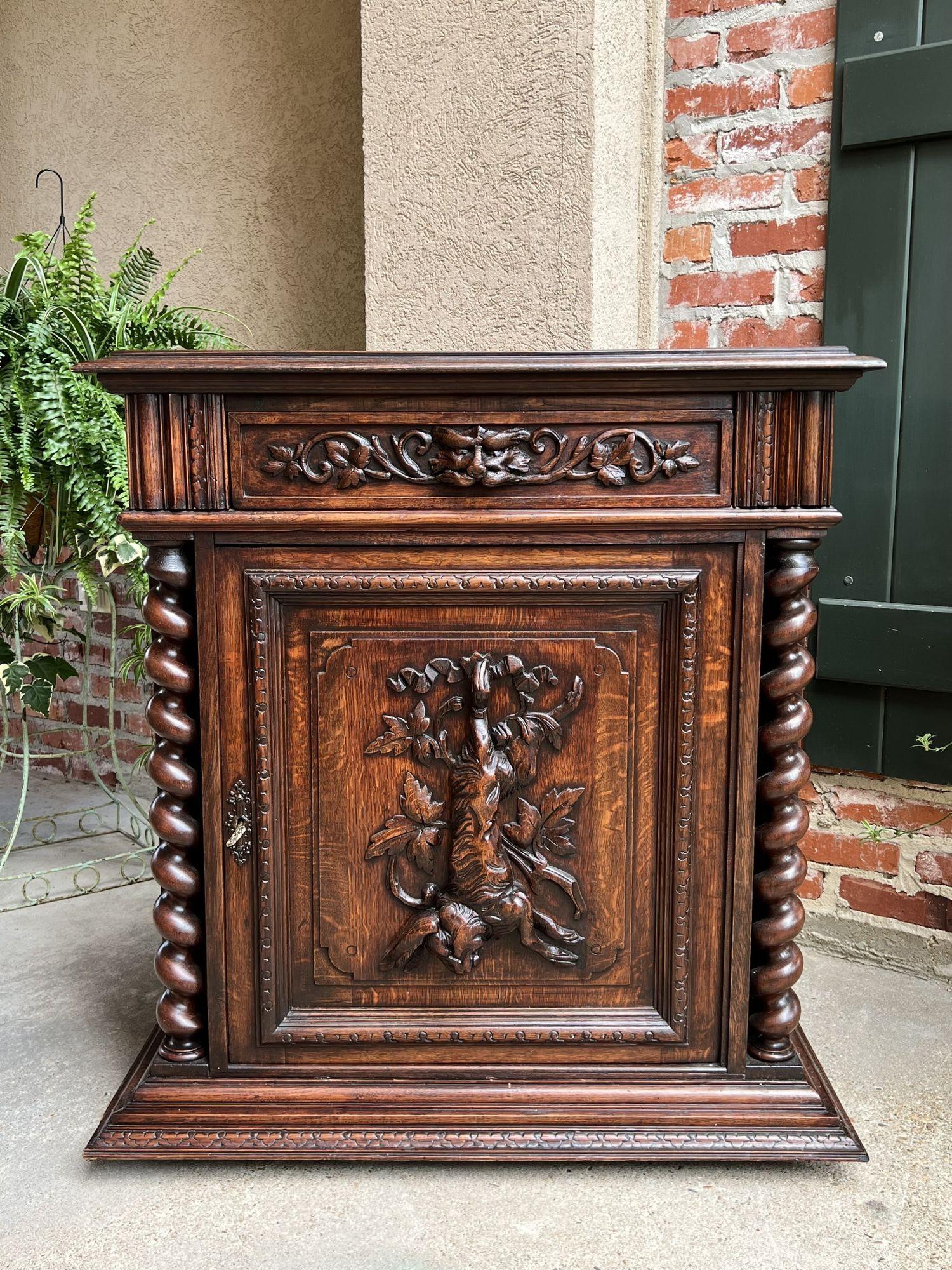 19th century French Carved Oak Hunt Cabinet Barley Twist Black Forest Wine Bar.
 
Directly imported from France, a beautifully hand carved 19th century French confiturier cabinet, in a versatile size, perfect for placement in any room and a customer