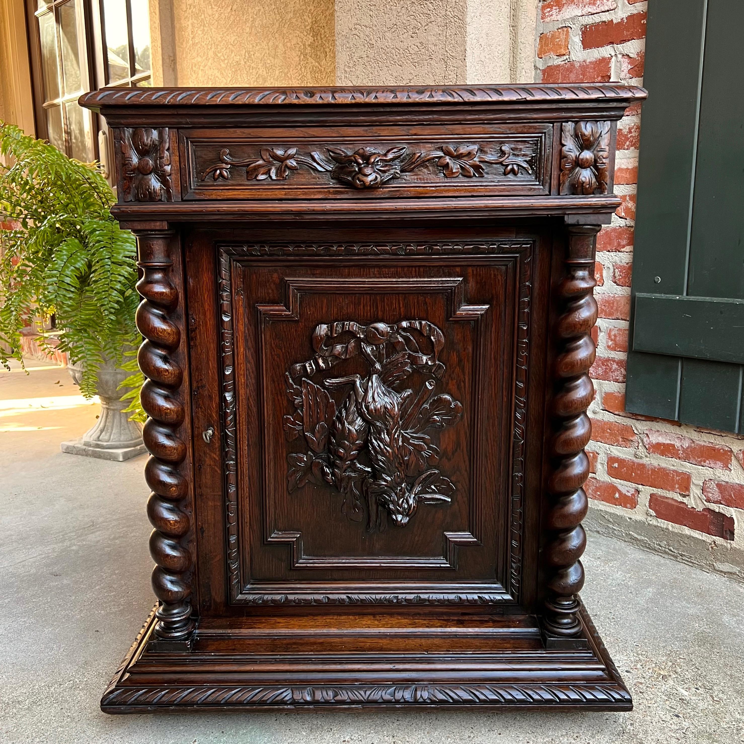 19th century French Carved Oak Hunt Cabinet Confiturier Barley Twist Rabbit.

Directly imported from France, a beautifully hand carved 19th century French confiturier cabinet, in a versatile size, perfect for placement in any room and a customer