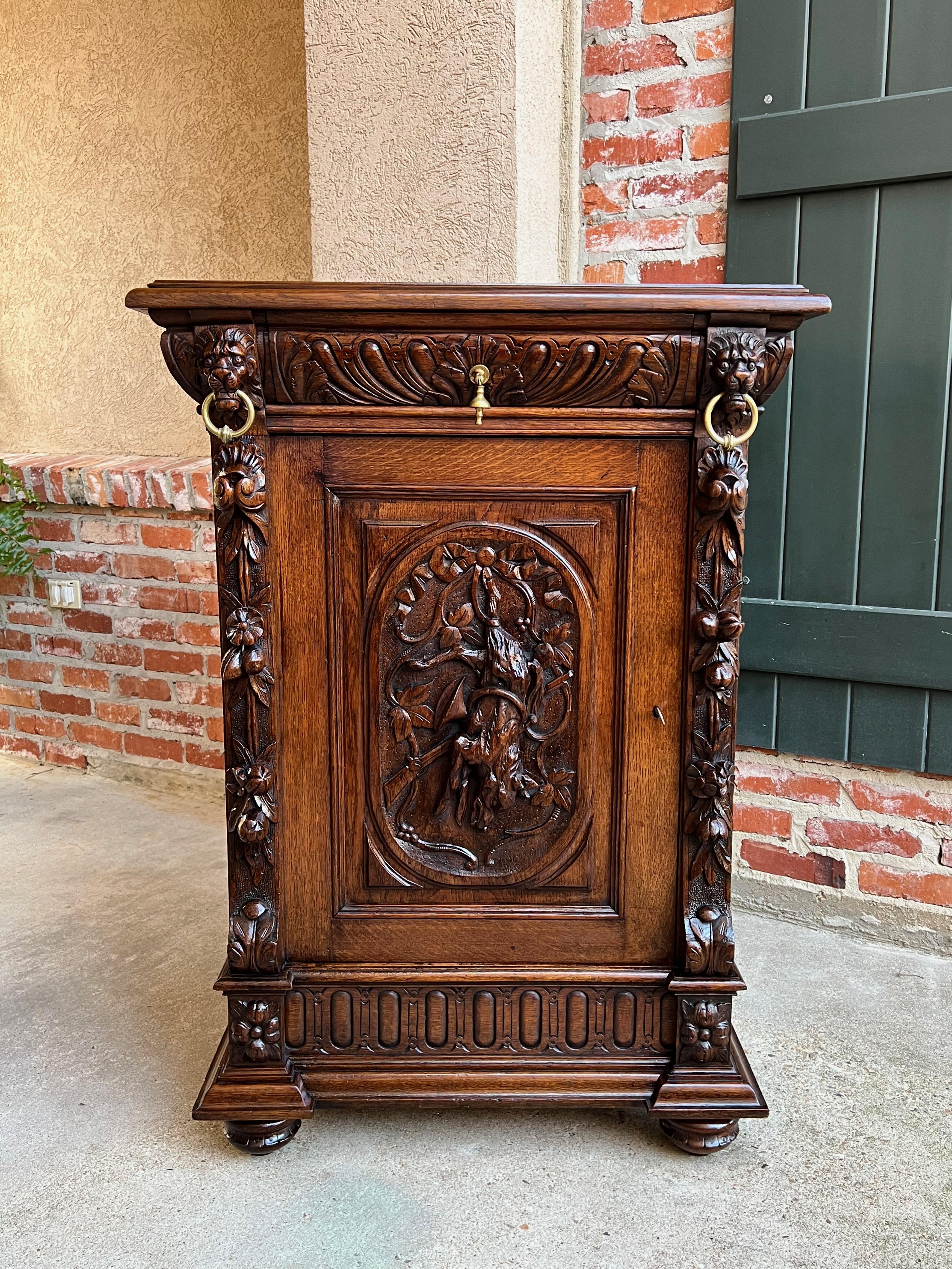 19th century French carved oak hunt cabinet Confiturier Black Forest fox.

Directly imported from France, a beautifully hand carved 19th century French confiturier cabinet, in a versatile size, perfect for placement in any room and a customer