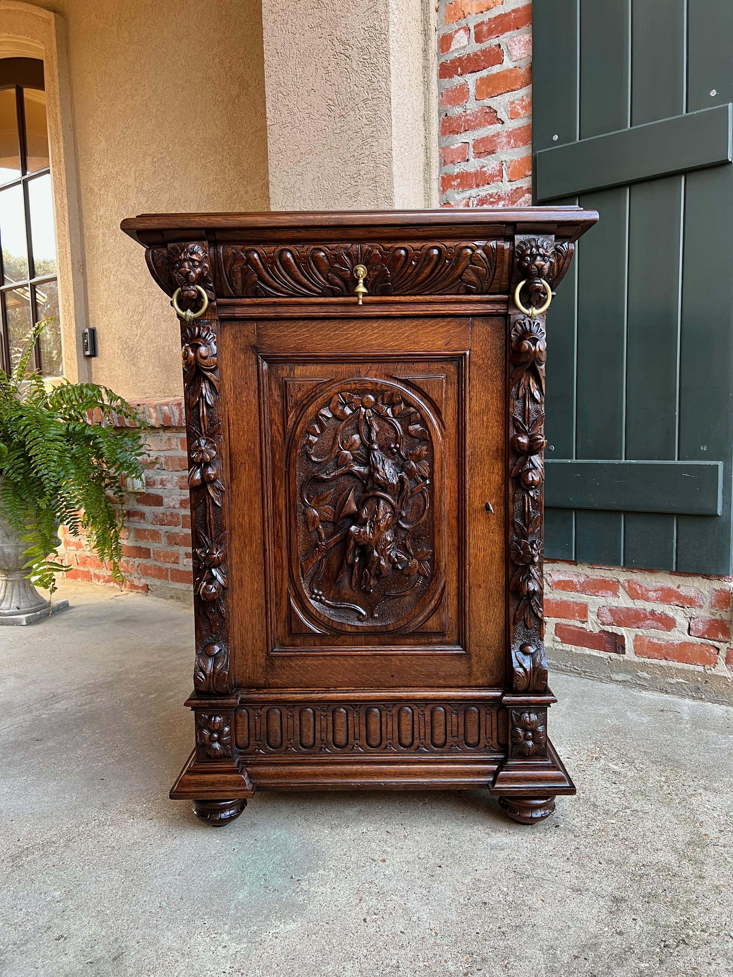 19th century French carved oak hunt cabinet confiturier black forest rabbits 

Directly imported from France, a beautifully hand carved 19th century French confiturier cabinet.
Beveled edge cabinet top over the carved frieze that features a full