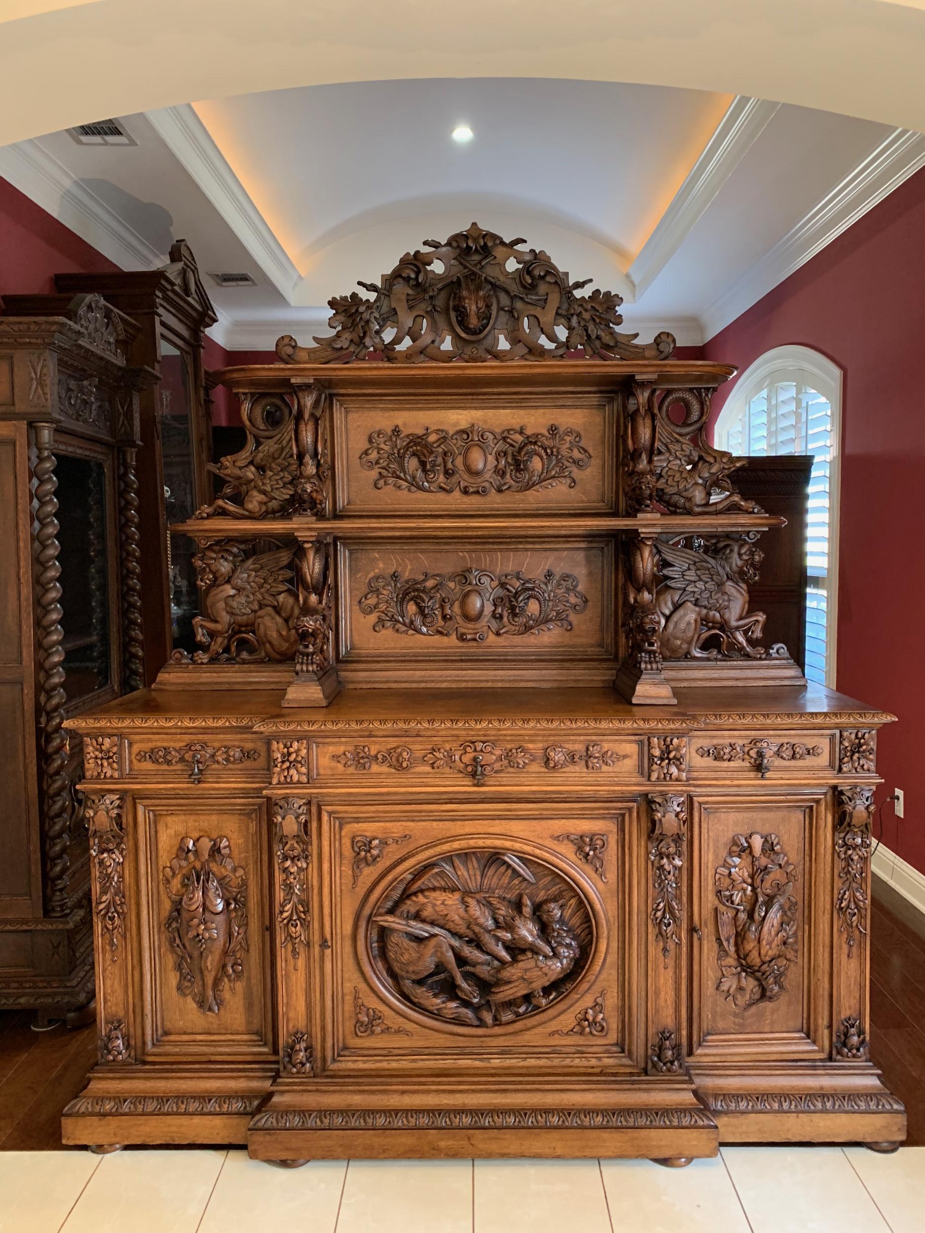 19th century French carved oak hunt cabinet Renaissance bookcase sideboard fox

~ Direct from France
~ This hand carved cabinet is one of those antiques that really just cause you to step back for a minute and study the details…the amazing