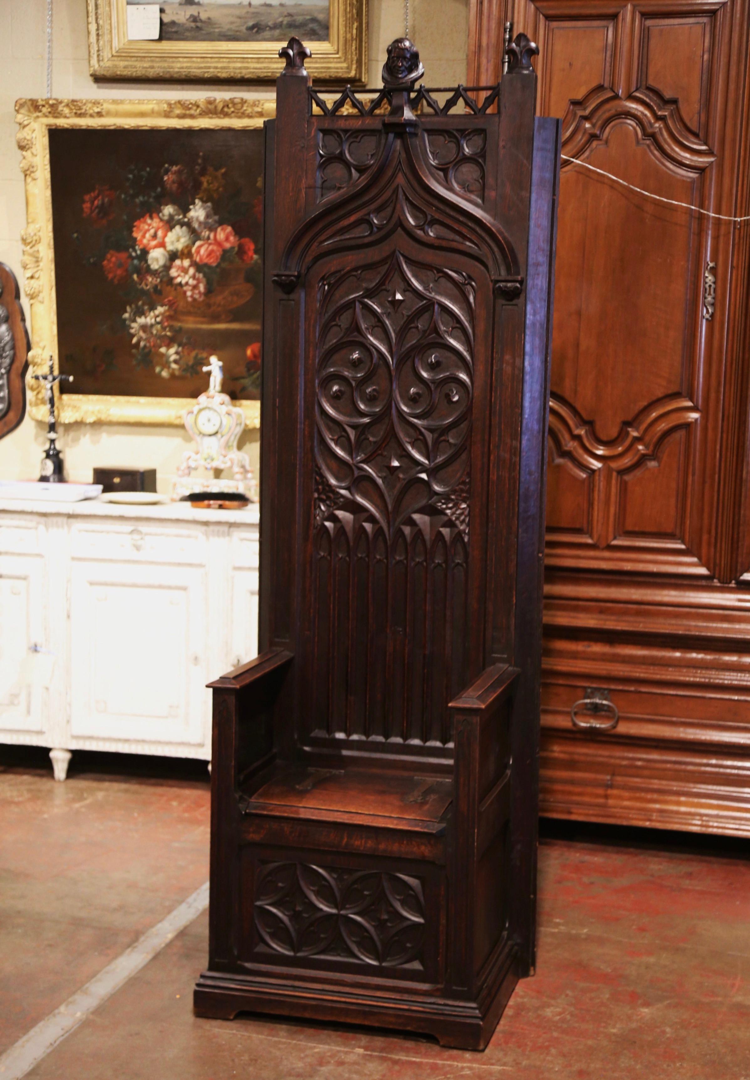This Gothic “Cathedre” (French for Cathedra or bishop’s throne) was crafted in southern France circa 1880. Built of oak, the chair stands on bracket feet over a straight plinth. The tall back is hand carved with pointed arch and tracery decor